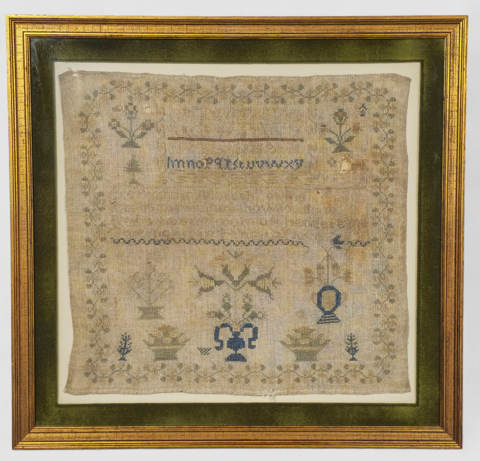 19th Century Lancaster County Sample: 19th Century Lancaster County Sample. Circa 1840-1860. Folk art design with numbers and alphabet on linen. Professionally framed and matted. Sampler - 16 x 16 7/8. Frame - 21 1/4 x 22 1/4.