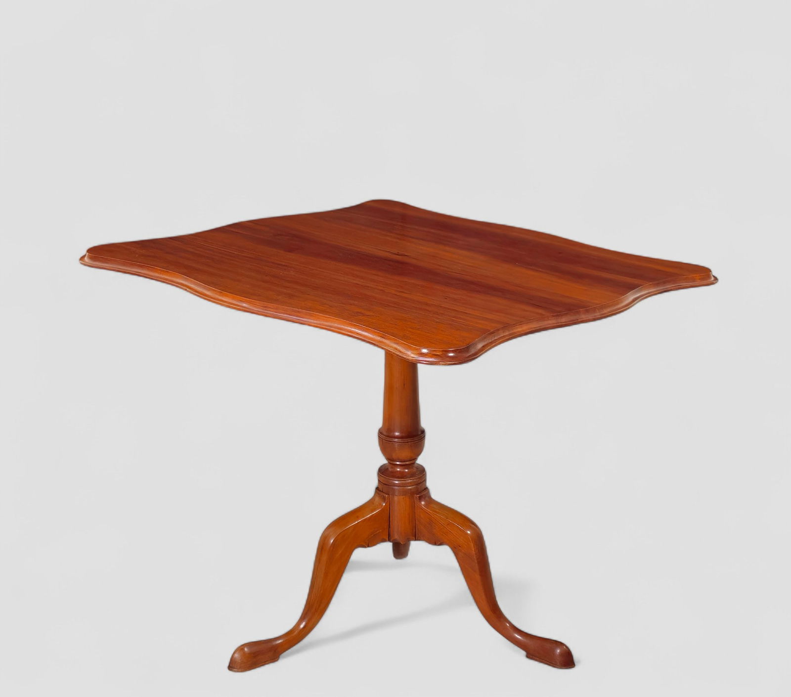 18th Century New England Queen Anne Cherry Handkerchief Table: 18th Century New England Queen Anne Cherry Handkerchief Table. Circa 1790. Square serpentine tilt top over an turned support. Snake cabriole legs terminating to Queen Anne pad feet. Closed - 32 1/2w