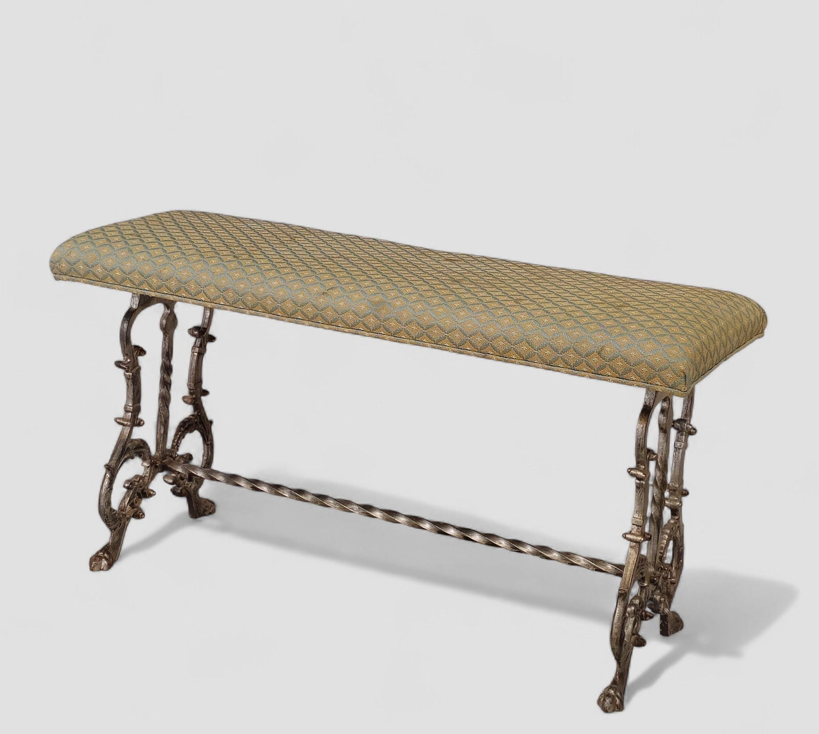 Art Deco Silver Leaf Iron Bench: Art Deco Silver Leaf Iron Bench. USA. 1920s. Silver leaf over iron and upholstery. Lyre form side, paw feet and twist stretcher. 36w x 14 1/2d x 19h.