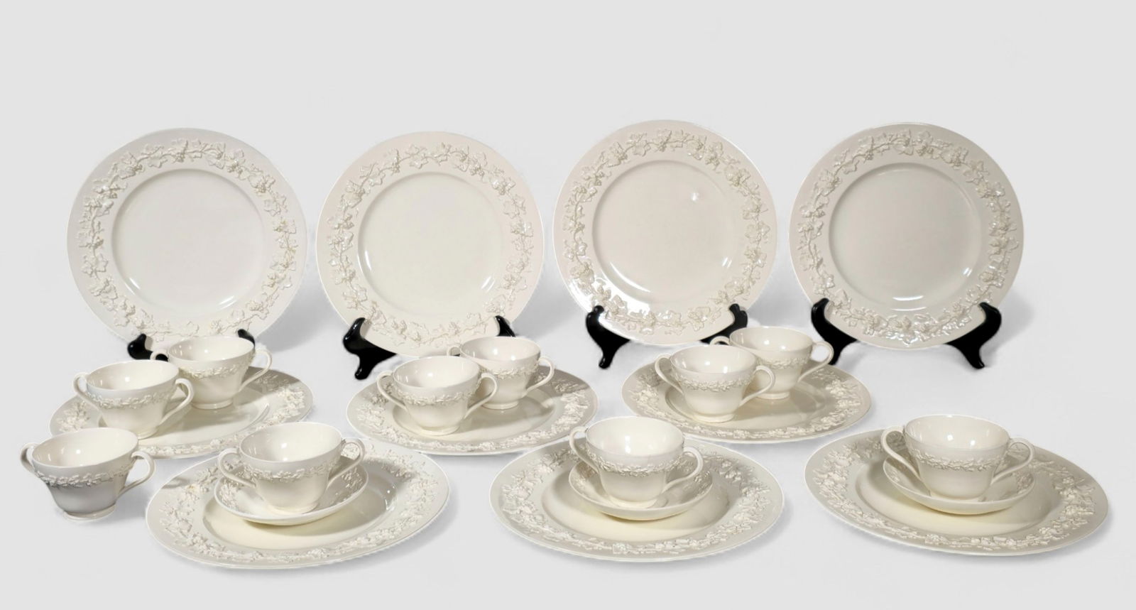 Partial Wedgwood Etruria Creamware "Grapevine Pattern": Partial Wedgwood Etruria Creamware "Grapevine Pattern". Circa 1900. 23 pieces total. 10 dinner plates, 10 bouillon cups and 3 saucers. Plates - 10 5/8 dia.
