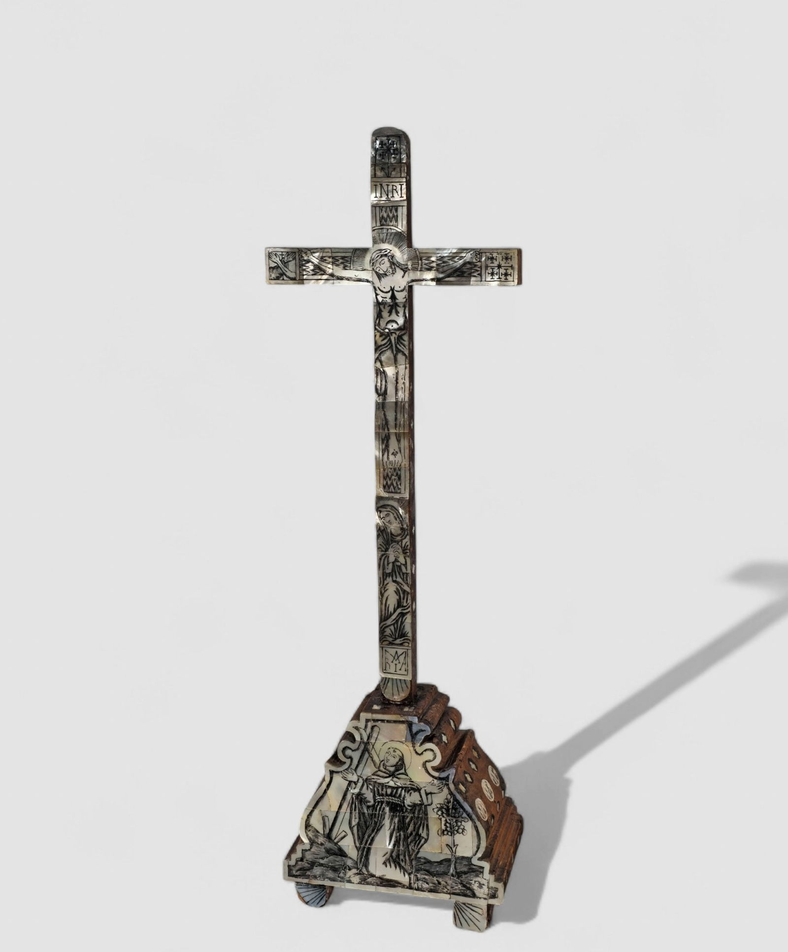 18th Century Jerusalem Engraved M.O.P Crucifix: 18th Century Jerusalem Engraved M.O.P Crucifix. Circa 1760. Mother of Pearl inlay with Mary and St. Dominic image at base receiving the stigmata. 6 1/8 w 3 3/4 d x 19 h.