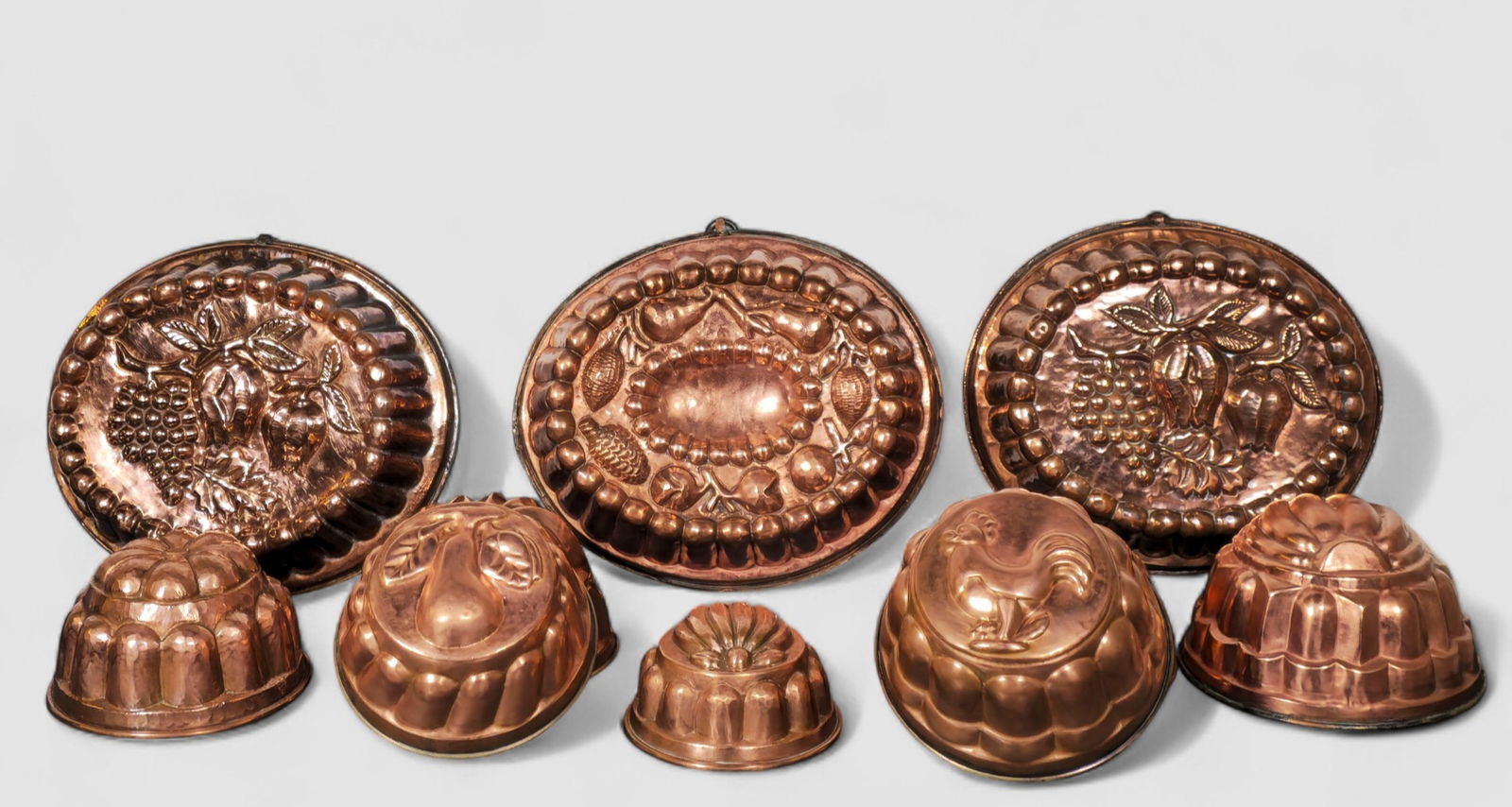 Assembled 19th Cand 20th French Century Copper Molds: Assembled 19th Cand 20th Century French Copper Molds. 8 total. Circa 1890-1910. Various sizes and shapes. Various designs and fruit, leaves, chicken and melon. Largest - 13w x 10 1/2 w x 4h, small - 7