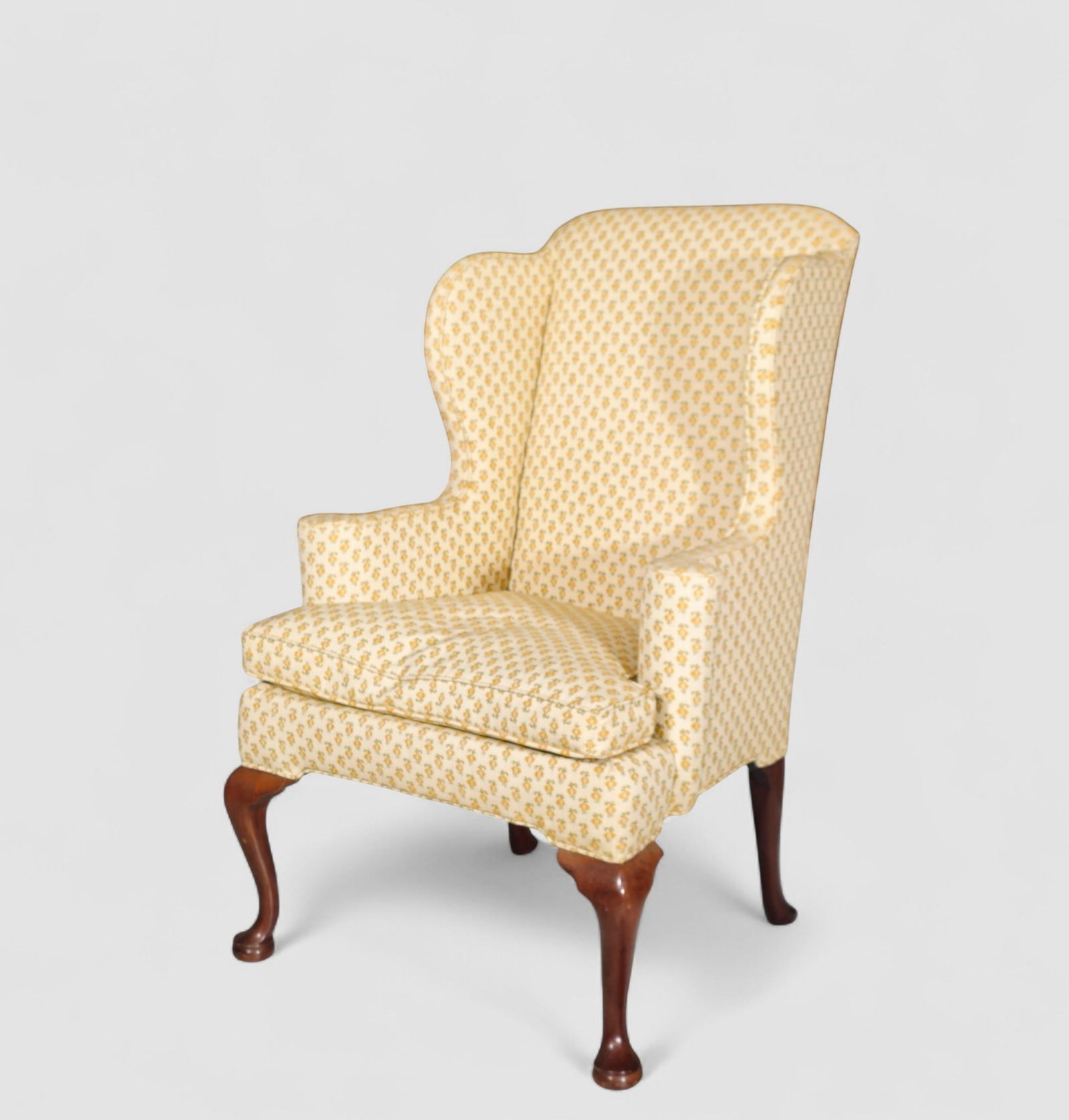 Kittinger Williamsburg Queen Anne Style Wing Chair: Kittinger Williamsburg Queen Anne Style Wing Chair. USA, 1940s. Flared upholstered frame with roll out arms. Manufacturer's label under cushion. CW branded mark to back left leg. Cabriole legs and