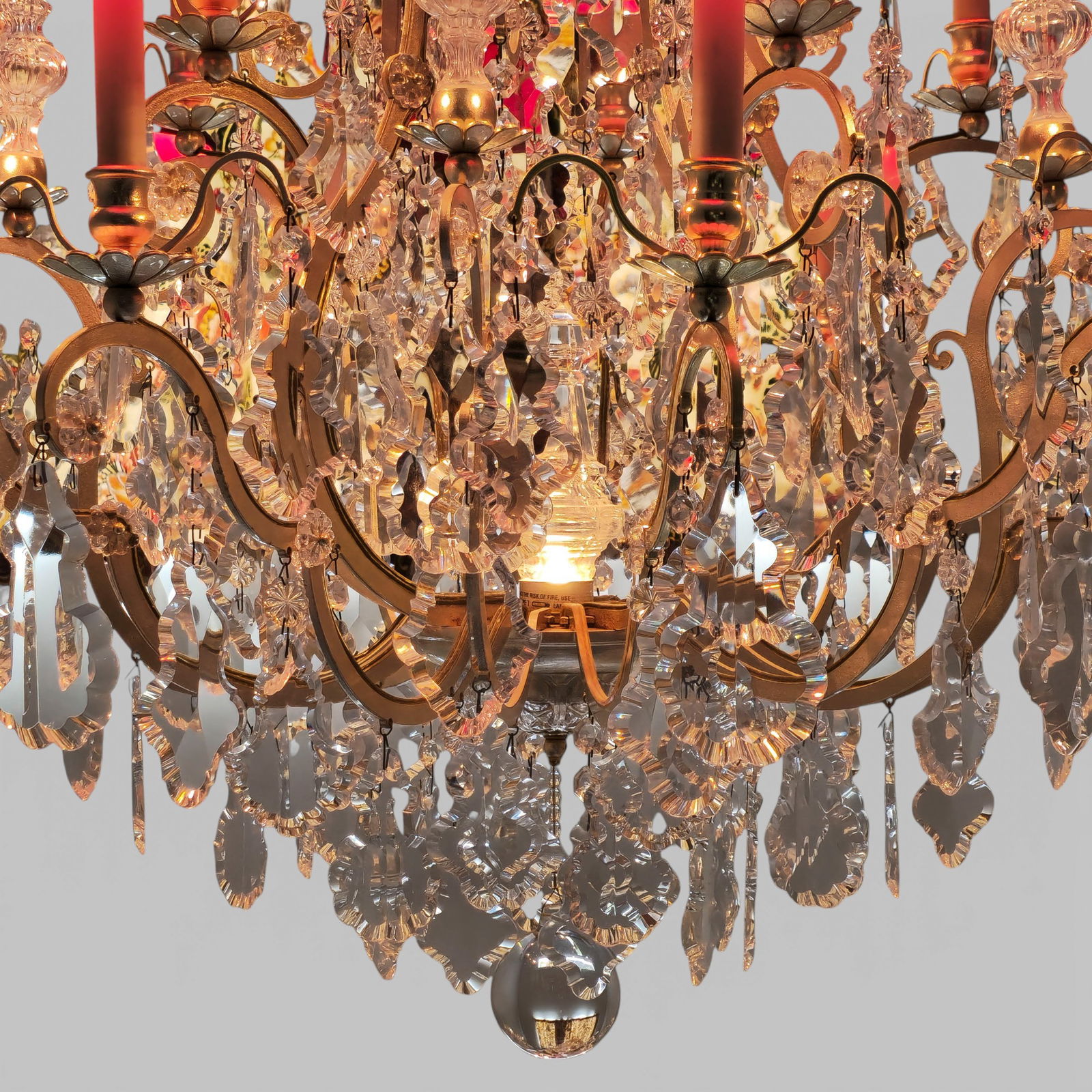 Schonbek Crystal Chandelier: Schonbek Crystal Chandelier. Fixture 2773-21. Schönbek gilt-metal and crystal chandelier, late 20th century, fitted with Heritage Hand cut crystal elements. Multi-light chandelier with scrolling