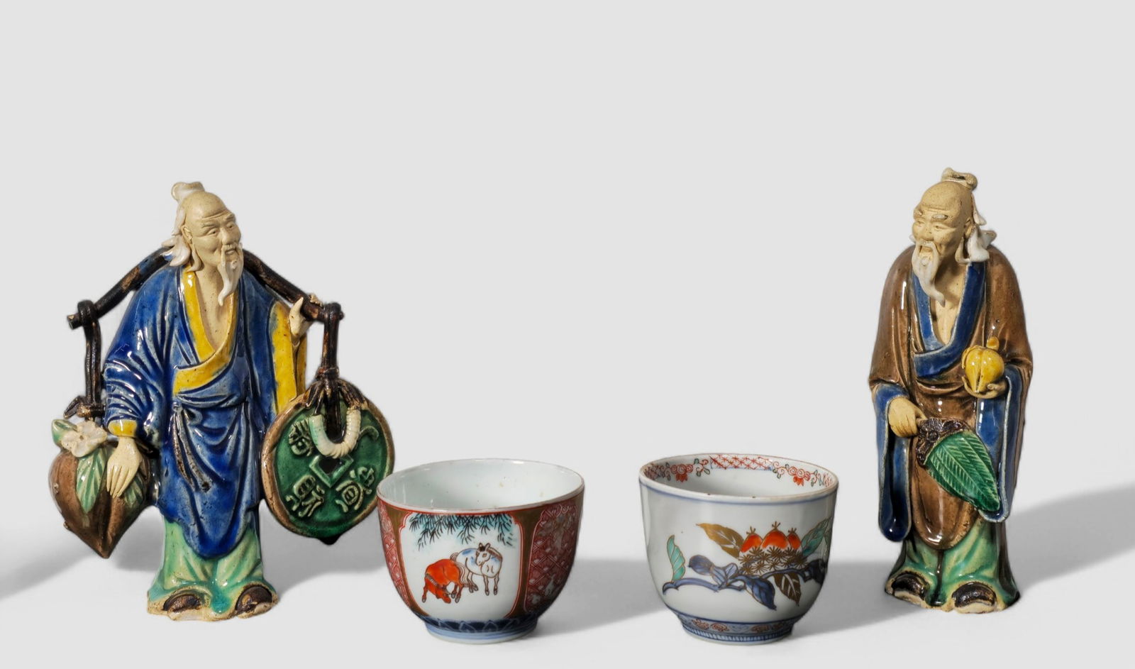 Chinese Mud Men and Japanese Imari Cups: Chinese Mud Men and Japanese Imari Cups. 4 pieces total. Mud Men. China circa 1910. Stamp China to underside. One 19th Century Japanese Imari cup, signed underglaze. One Imari cup circa 1910-1920.