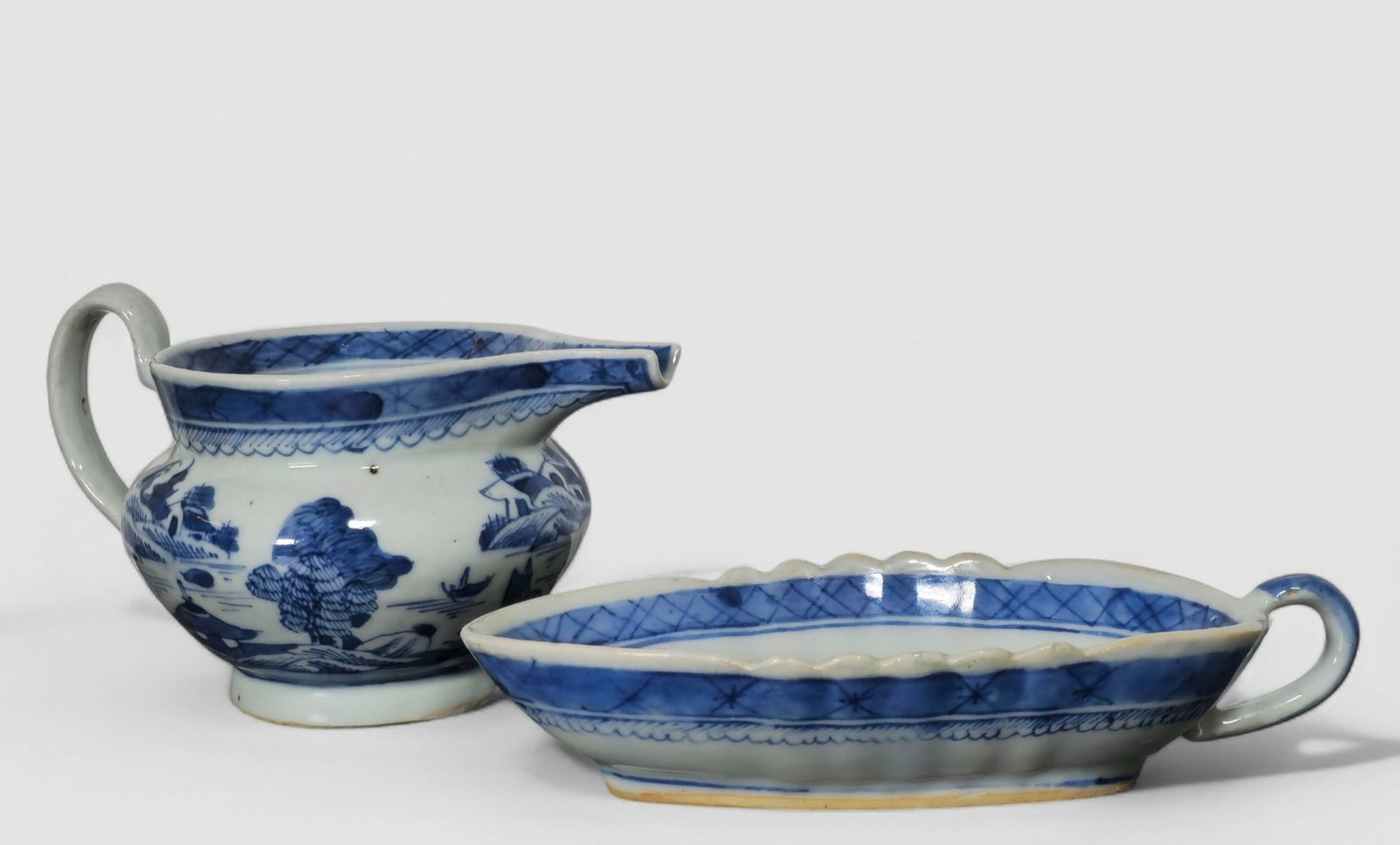 19th Century Chinese Canton Pitcher and Sauce Boat: 19th Century Chinese Canton Pitcher and Sauce Boat. 2 piece total. Cream pitcher. Circa 1830. Sauce boat, circa 1830. 7w x 3 7/8 d x 1 1/4 h.