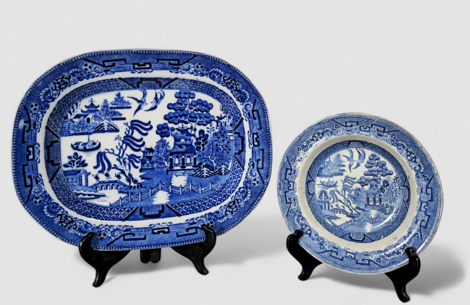 Blue Willow Transferware Platter & Staffordshire Stoneware Bowl: Blue Willow Transferware Platter & Staffordshire Stoneware Bowl. Cobalt blue platter Newport Pottery Co. Burlsem, England. Circa 1900. 15 1/2w x 12 1/4d . Staffordshire stoneware bowl for Burslem.