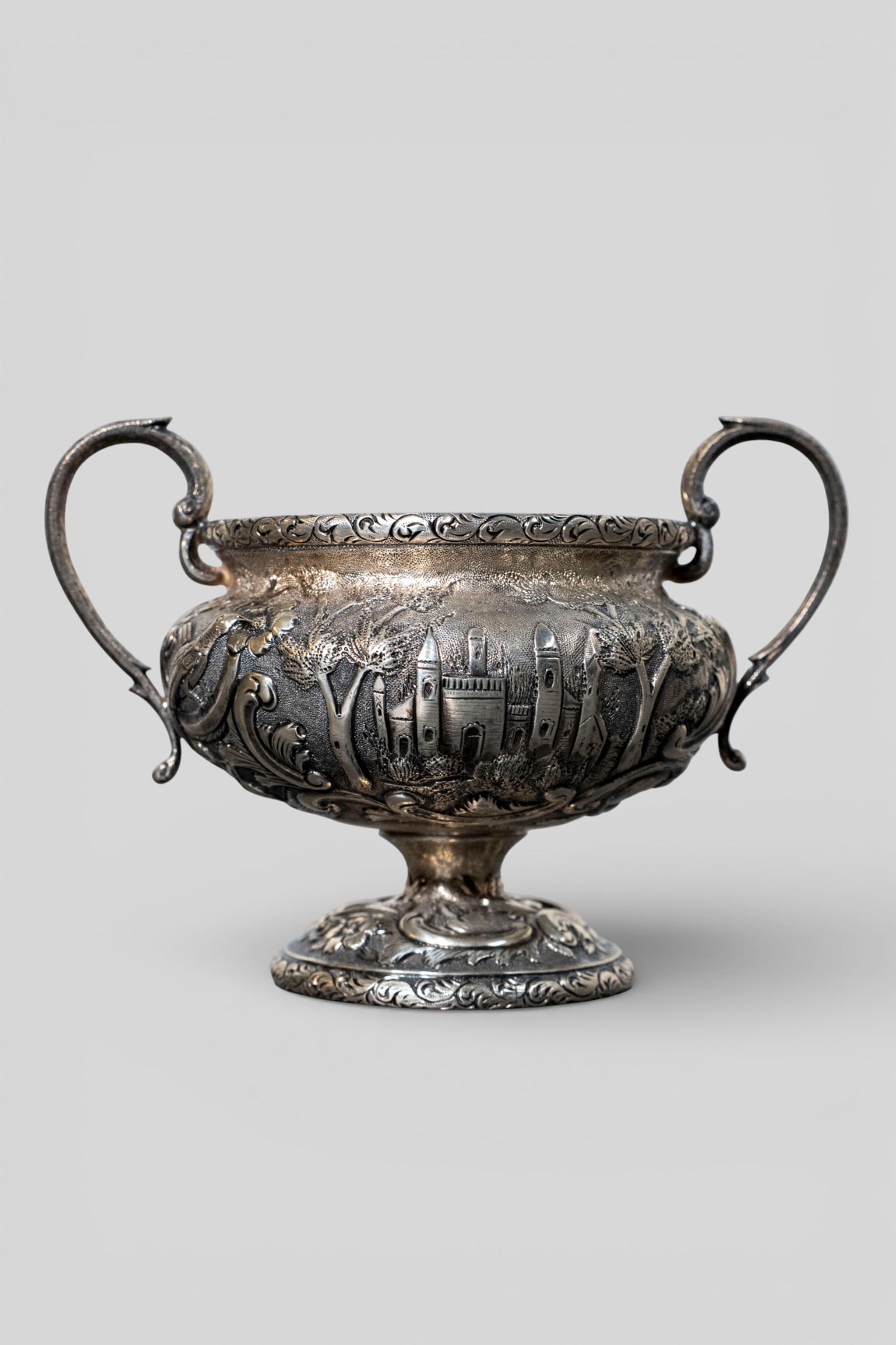 Loring Andrews Sterling Silver Castle Pattern Sugar Bow, #207: Loring Andrews Sterling Silver Castle Pattern Sugar Bowl, #207. Repousse design with castle, flowers, scrolls, and landscapes. Manufacturer's marks to underside, sterling and #207. 5 5/8w x 4d x 4h.