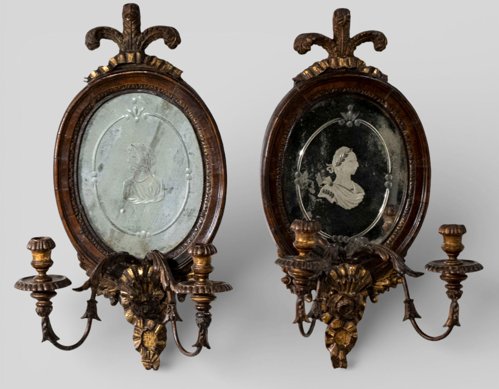 18th Century Georgian Mahogany & Gilt Double Arm Sconces: 18th Century Georgian Mahogany & Gilt Double Arm Sconces. Pair. Circa 1780-1800. Dante & Beatrice incised oval mirrors. Plum decoration. A fine pair of scones. 10 1/2w x 7 3/4d x 19h.