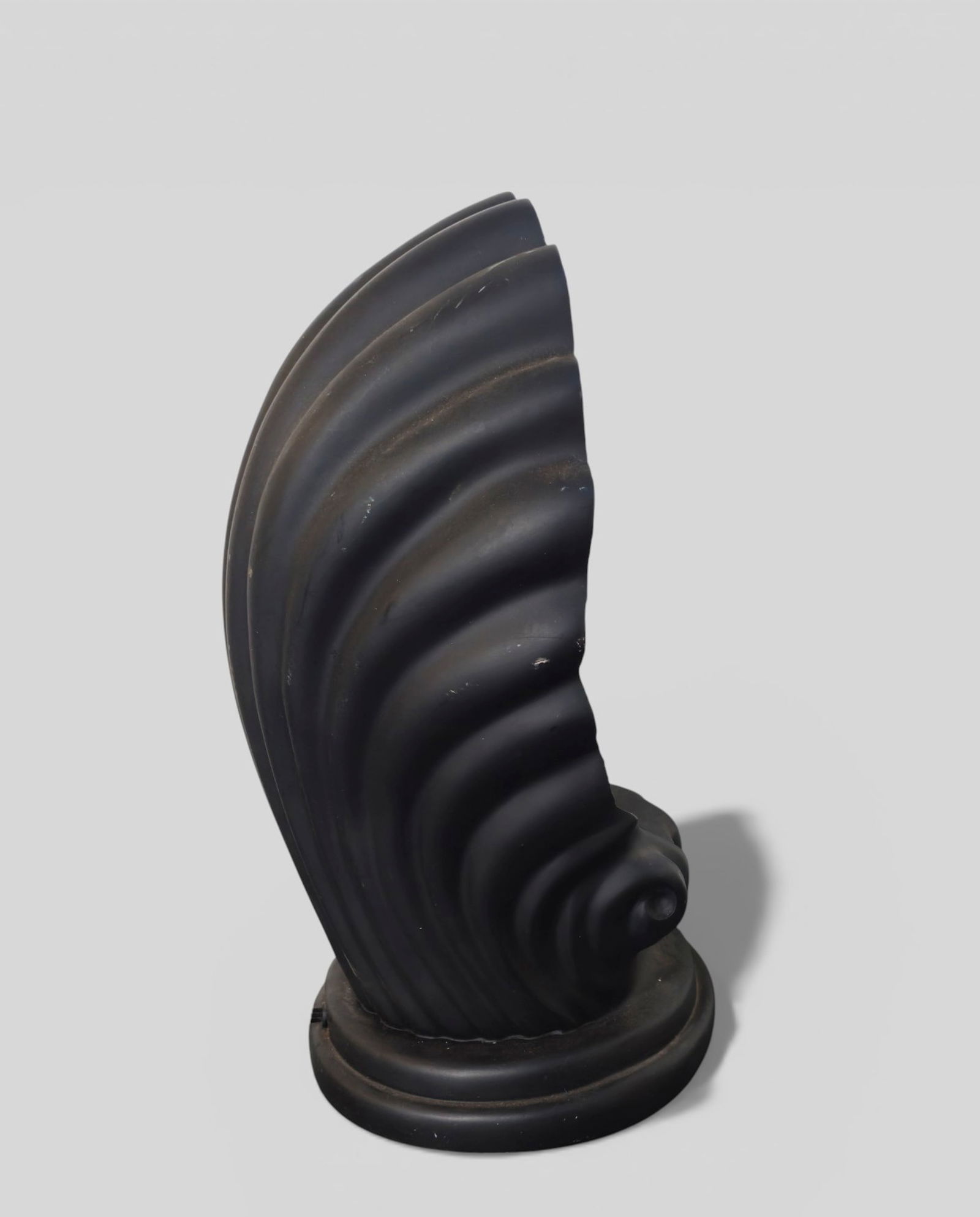 Art Deco Revival Shell Lamp: Art Deco Revival Shell Lamp. USA. Late 1970s. Black scrolled shell form table lamp. 11w x 9d x 16h.