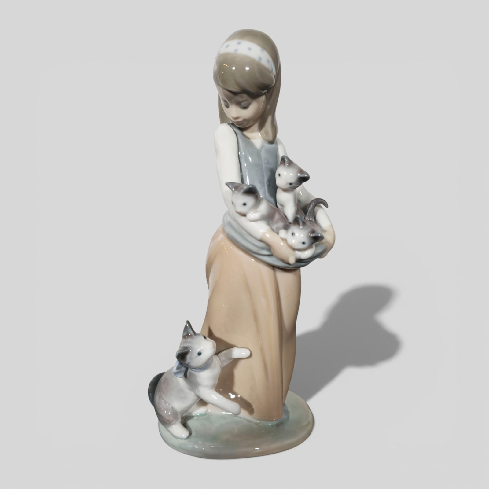 Lladro Girl With Cats, #1309: Lladro Girl With Cats, #1309. Spain. 4 1/2w x 4d x 9 3/8h.