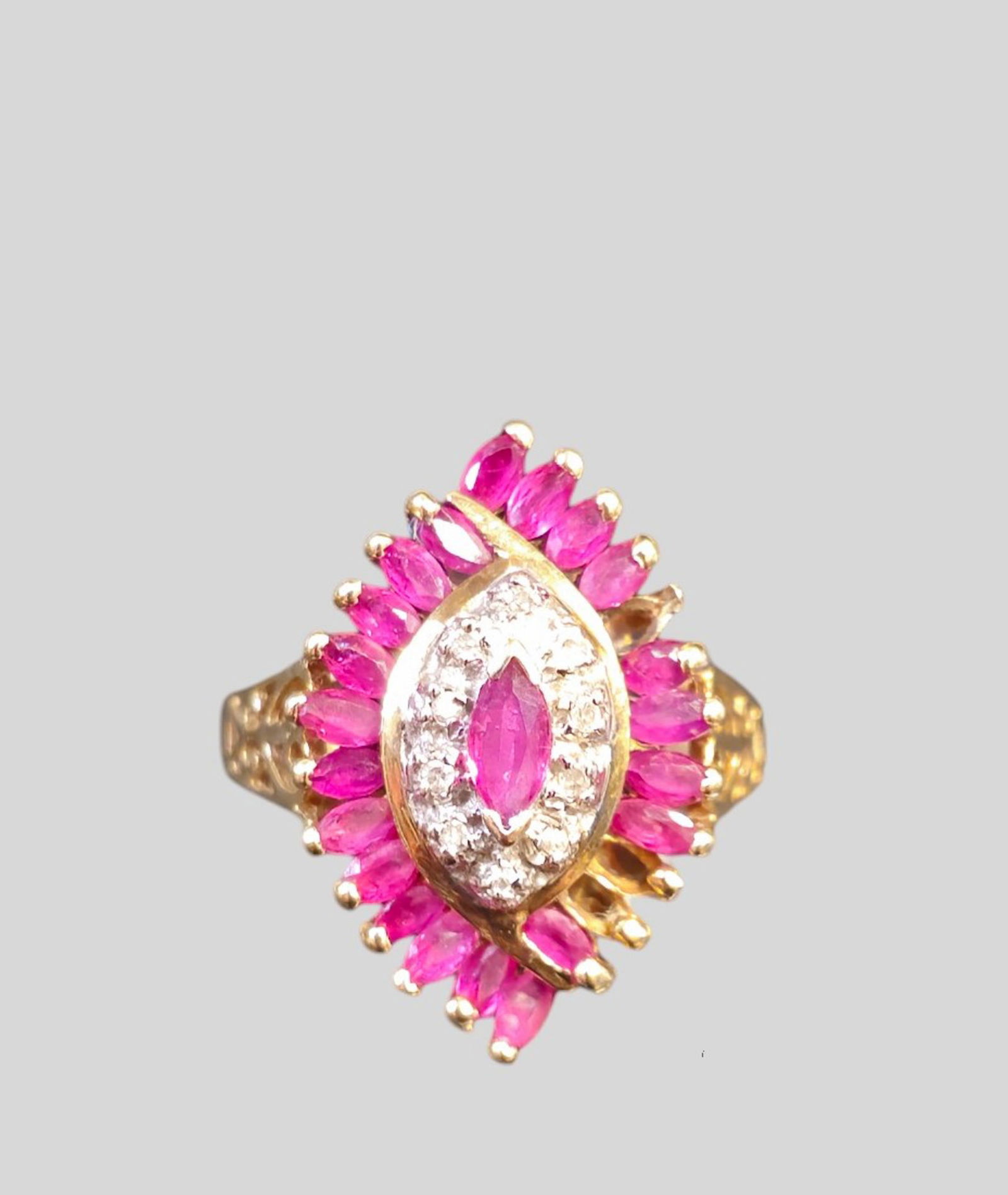 10K Gold Ring With Diamonds and Ruby Cocktail Ring: 10K Gold Ring With Diamonds and Ruby Cocktail Ring. Size 10. Small diamonds and 21 oblong cut ruby's. Filagree band. Total gross weight - 4 grams. Size - 5 3/4.