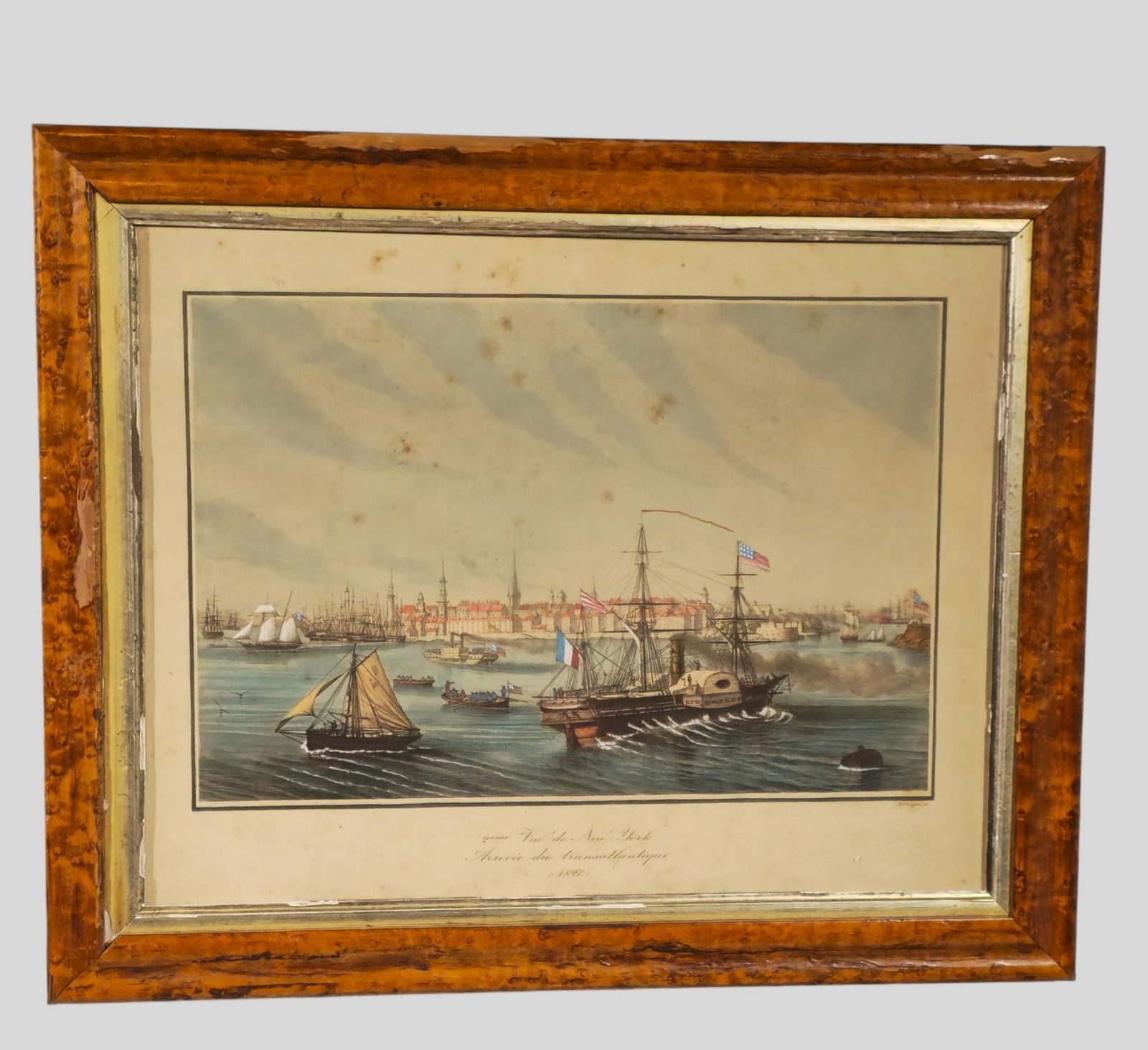 Hand Colored Etching by Louis Le Breton, "Vue de New York Arrivee du Transatlantique": Louis Le Breton (1818-1866, France) Marine engraver. Engraving on paper, "Arrival of the Transatlantic Packet Boat." Originally 1820. This particular engraving is circa 1845. Housed in maple burl fram