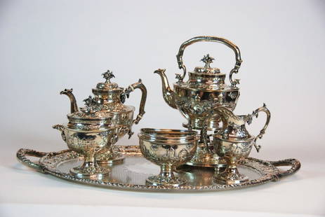 Amazing Kirk and Sons Castle Tea Set: Fabulous Sterling Silver Tea Set with matching tray. All pieces have embossed castles, houses, trees, columns and birds. Tilt hot water and stand and alcohol burner, on feet, coffee pot both with Ivor