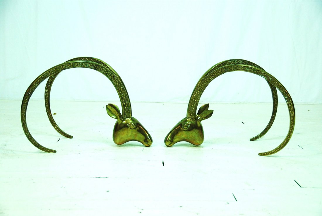 In the manner of Leon Francois Chervet: Pair of ornate brass plated ram heads. Unsigned. No Glass. 23.5 x 17.75W x 16H