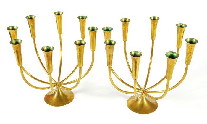 Pair of Danish Candelabras: Simple and elegant pair of brass candelabras. 1950's. Great quality. Stamped Illums Bolighus, Denmark. Original place where purchased, designer unknown. 12.25W x 12.25D x 11.25H