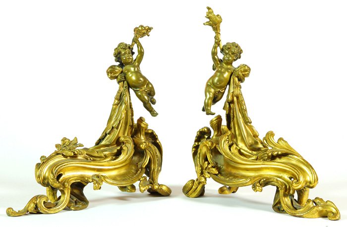 Pair French Bronze Figural Andirons: Pair French Bronze Figural Andirons in gilt finish with cherubim holding torch on floral scrolled base, circa 1870's. 16 Long and High