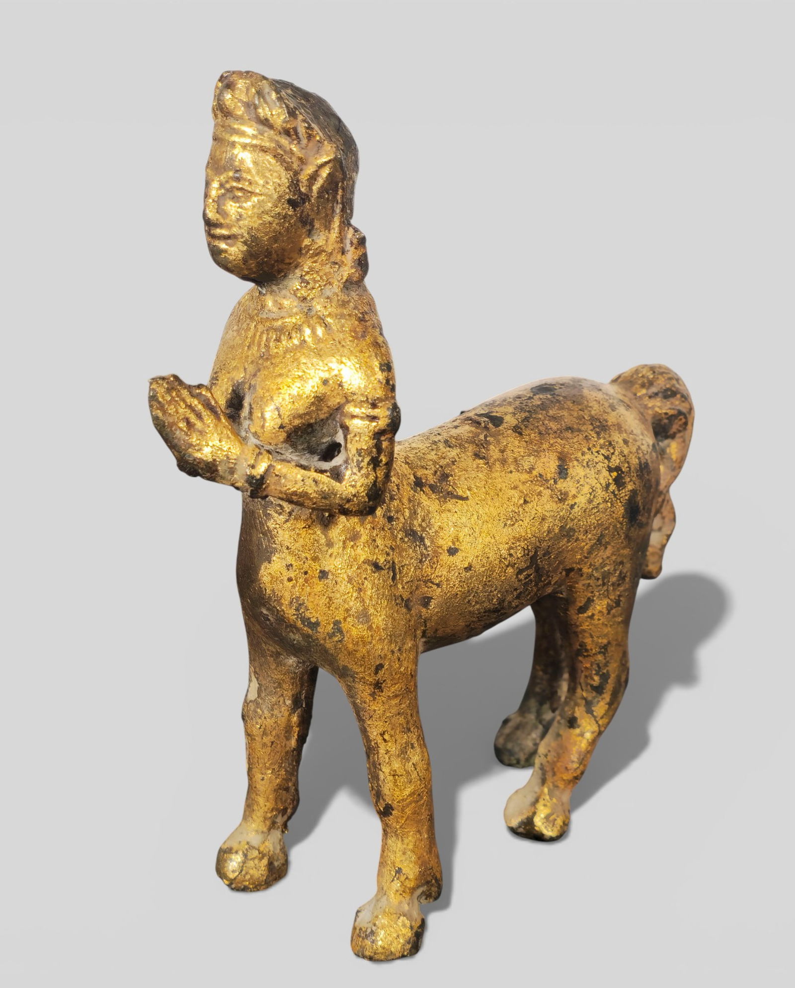 17th Century Southeast Asian Deity Figure: 17th Century Southeast Asian Deity Figure in Prayer Pose. 17th century Southeast Asian deity or temple figure, possibly Thai, depicted in a prayer pose with a half human, half horse body. The sculptur