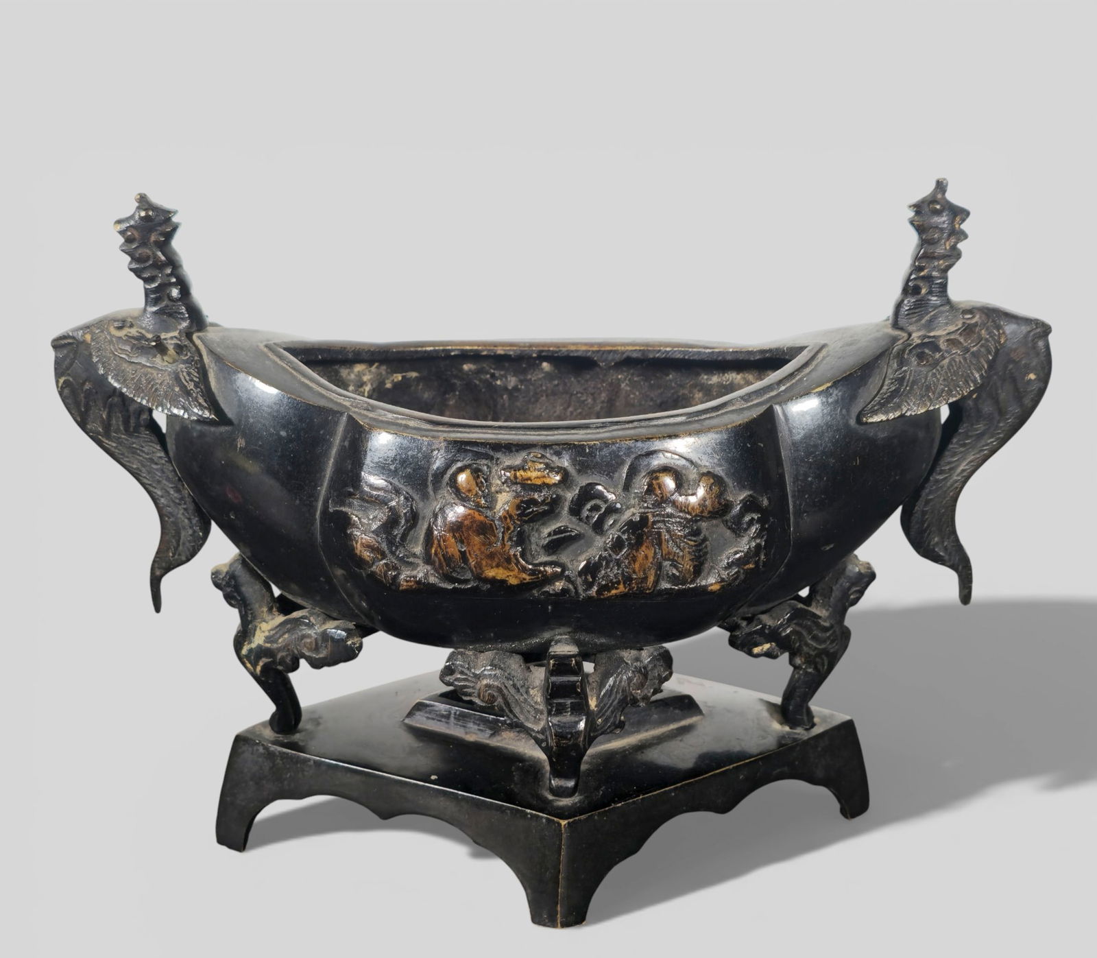 Chinese Qing Dynasty Patinated Bronze Incense Burner with Phoenix Handles: Chinese Qing Dynasty Patinated Bronze Incense Burner with Phoenix Handles. Finely cast patinated bronze incense burner dating to the Qing Dynasty, fitted with elegantly carved phoenix‑form