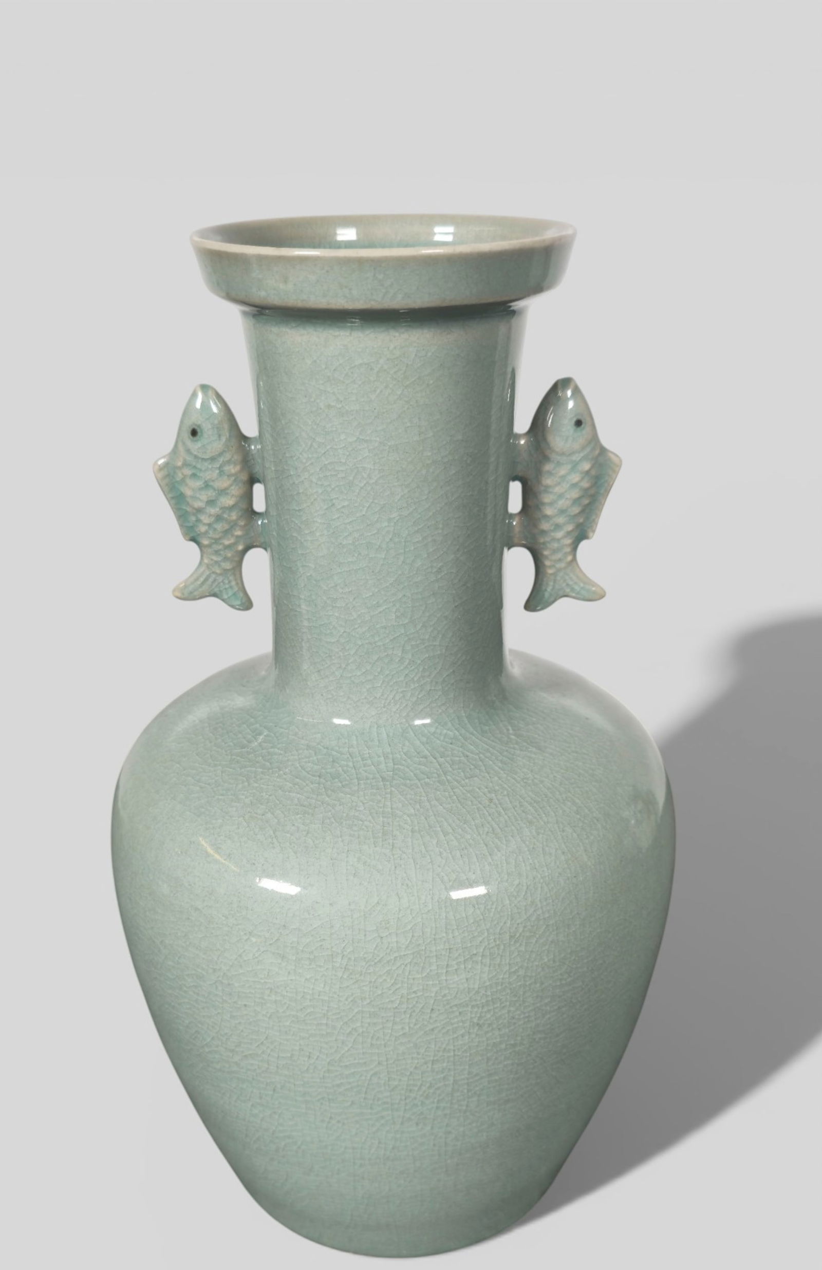 Chinese/Korean Celadon Vase with Fish Handles: Chinese/Korean Celadon Vase with Fish Handles. Chinese/Korean celadon vase with twin fish‑form handles, the body finished in a classic crackle‑glazed celadon tone. The base bears an