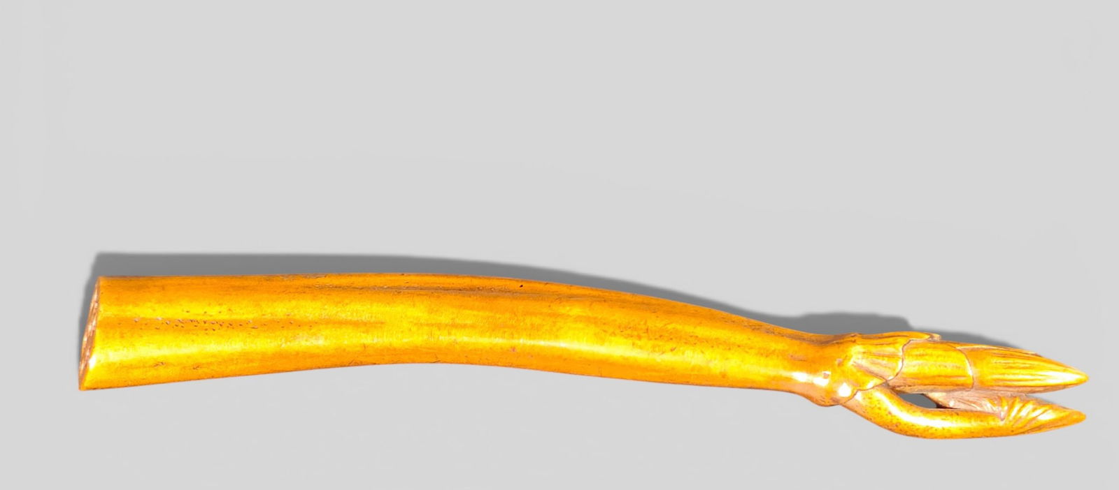 Rare Japanese Netsuke Carved as a Lotus Stem with Unopened Bloom: Rare Japanese Netsuke Carved as a Lotus Stem with Unopened Bloom. Rare and elegant Japanese netsuke carved as a slender lotus stem with an unopened flower just beginning to bloom. The carver captured