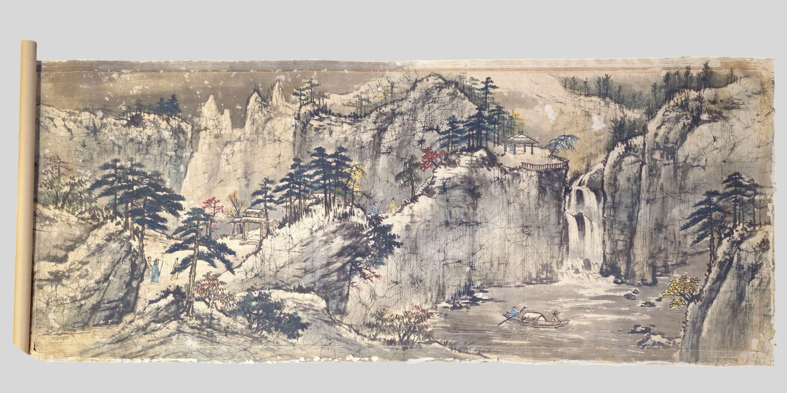 Large Chinese Ming Dynasty Silk Landscape Painting: Large Chinese Ming Dynasty Silk Landscape Painting. Large Chinese Ming dynasty silk painting depicting an expansive landscape with waterfall, structural buildings, and a fisherman on a lake. Executed