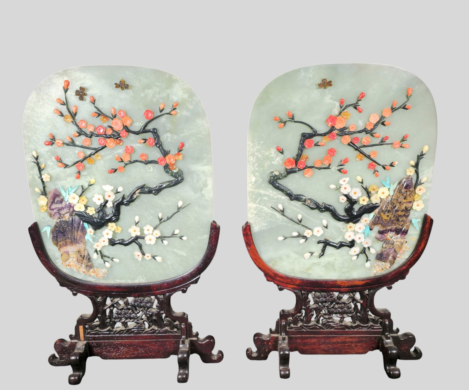 Fine Pair of 19th/Early 20th Century Chinese Jade Table Screens: Fine Pair of 19th/Early 20th Century Chinese Jade Table Screens. Highly figured, flowering trees composed of coral, amber, onyx and petrified wood. Carved openwork rosewood bases with scrolled feet; J
