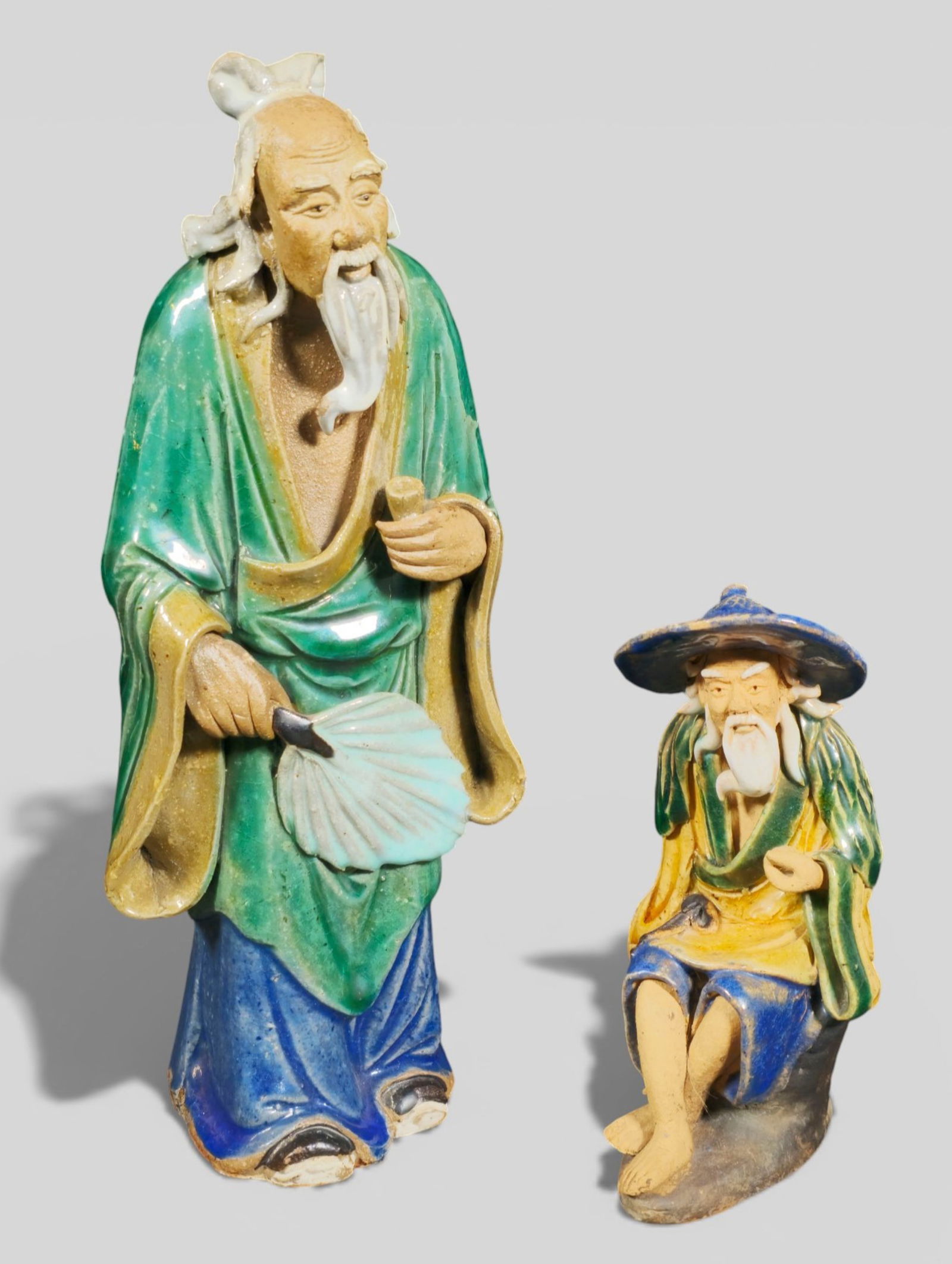 Early 20th Century Chinese Mudmen: Early 20th Century Chinese Mudmen. Tall & short wisemen. Each stamped china to underside. Tall 3 1/4w x 2 3/4d x 8 1/2h. Short 2 1/4w x 2 1/8d x 4 1/2h.