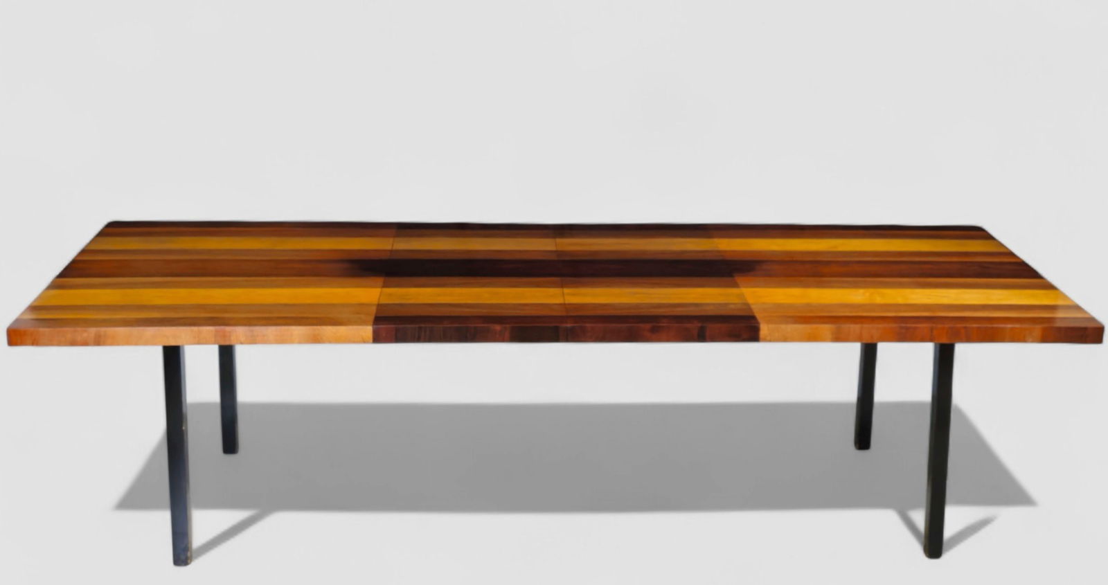 Milo Baughman Dining Table: Milo Baughman dining table featuring a dramatic striped hardwood top composed of alternating light and dark boards, creating a bold linear graphic. The substantial rectangular surface is supported