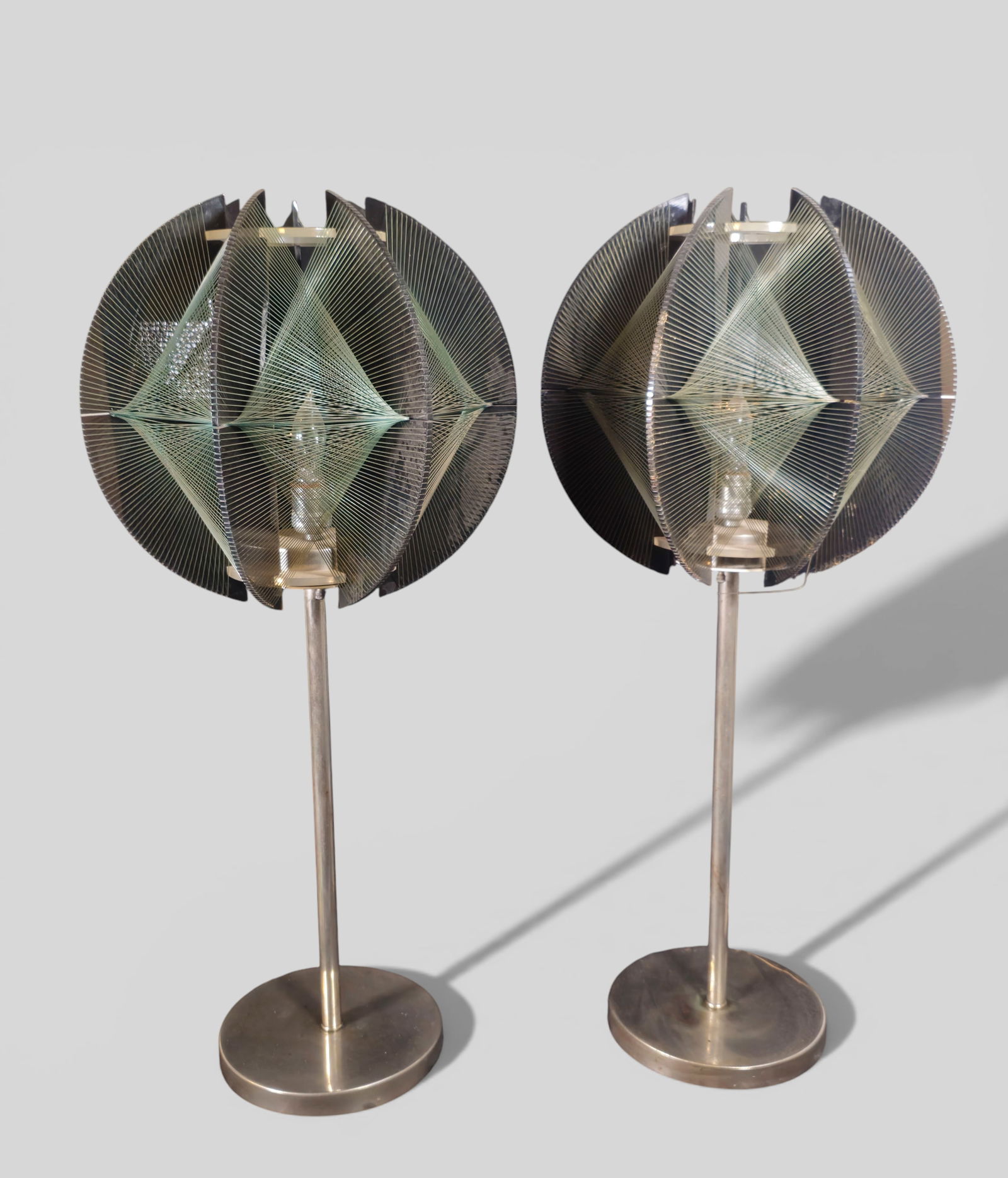 Paul Secon MCM Table Lamps: Paul Secon MCM Table Lamps. Pair. Sompex. Germany, 1970. Chrome plated metal, lucite and string. 13w x 13d x 32h.