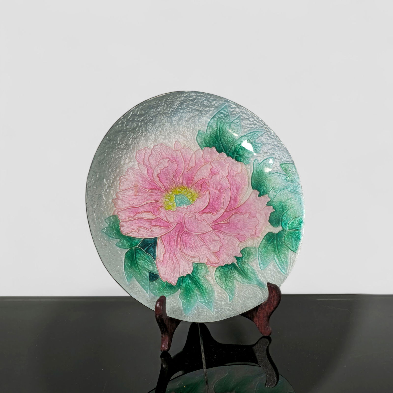 Japanese Ando Cloisonne Enamel Plate: A finely crafted Ando cloisonné enamel plate featuring a detailed pink peony in full bloom surrounded by lush green foliage, rendered against a textured silvery ground. Produced by the renowned