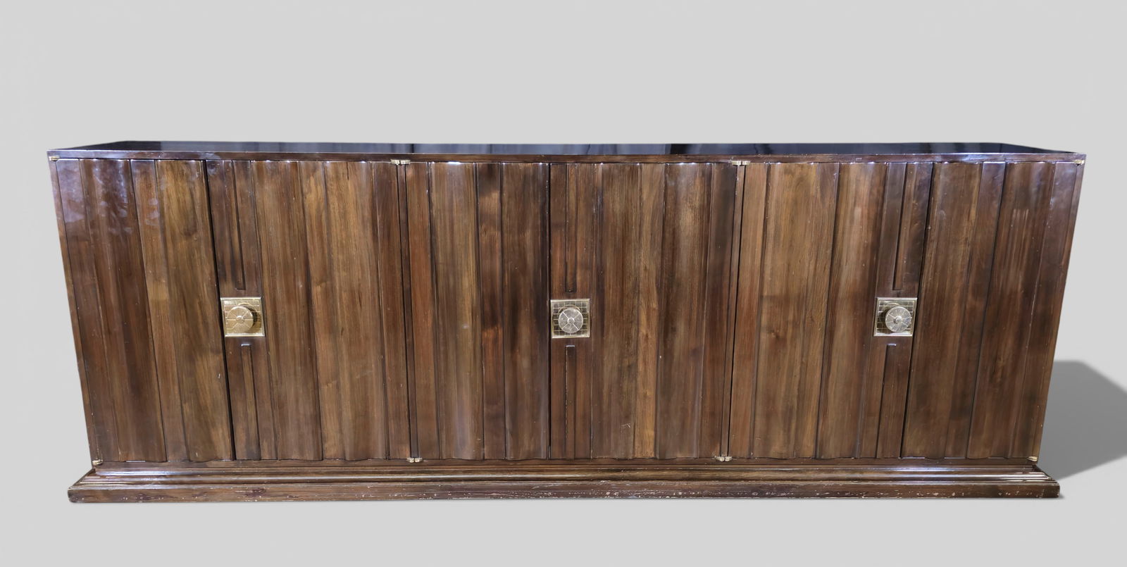 Tommi Parzinger Cabinet / Credenza: Tommi Parzinger Cabinet / Credenza. Parzinger Originals. USA. Cabinet Features 6 doors. Interior drawers and adjustable shelves. Mahogany and Brass. 99 3/4w x 21 1/4d x 34 1/4h.