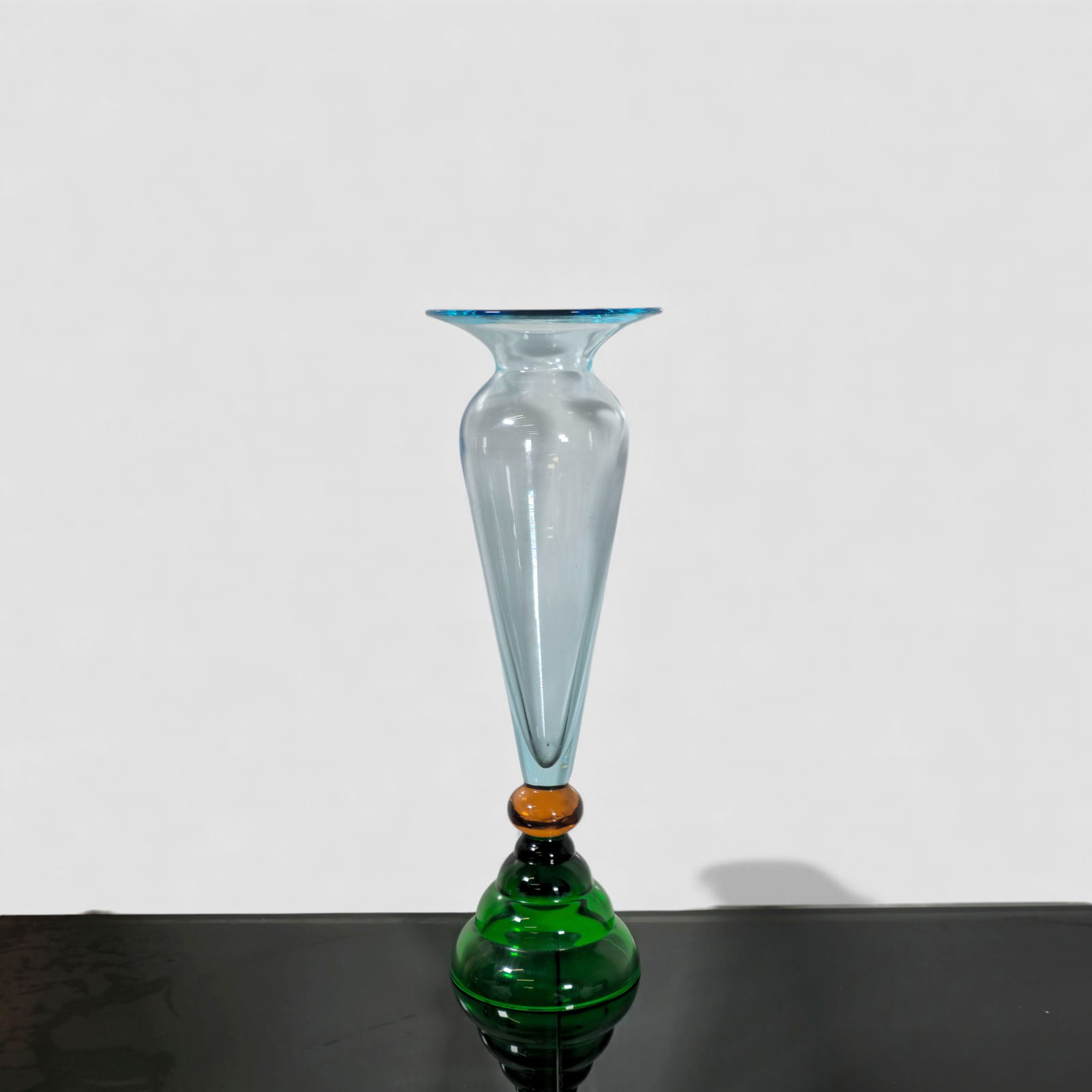 Murano Art Glass Vase: Murano art glass vase, hand-blown in stacked, sculptural form with bold color-block segments including emerald green, amber, black, and pale aqua. The piece features a dramatic elongated conical body