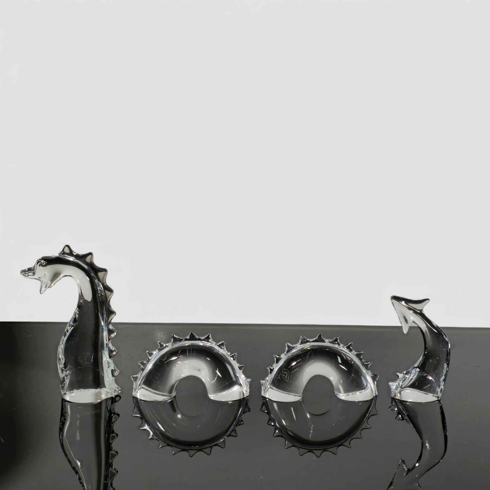 Baccarat Crystal Loch Ness Monster Sculpture: Baccarat (France). Signed crystal sculpture modeled as the legendary Loch Ness Monster, formed in three interlocking sections — head, mid-body, and tail — each crafted in clear French crys