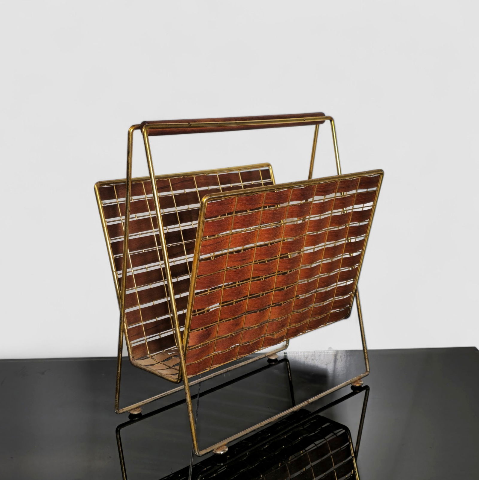 Tony Paul Interface Magazine Rack, Model 577: Tony Paul Interface Magazine Rack, Model 578. Woodlin-Hall. USA. 1955. Walnut and brass. 15 1/8w x 9 1/2d x 17 1/2h.