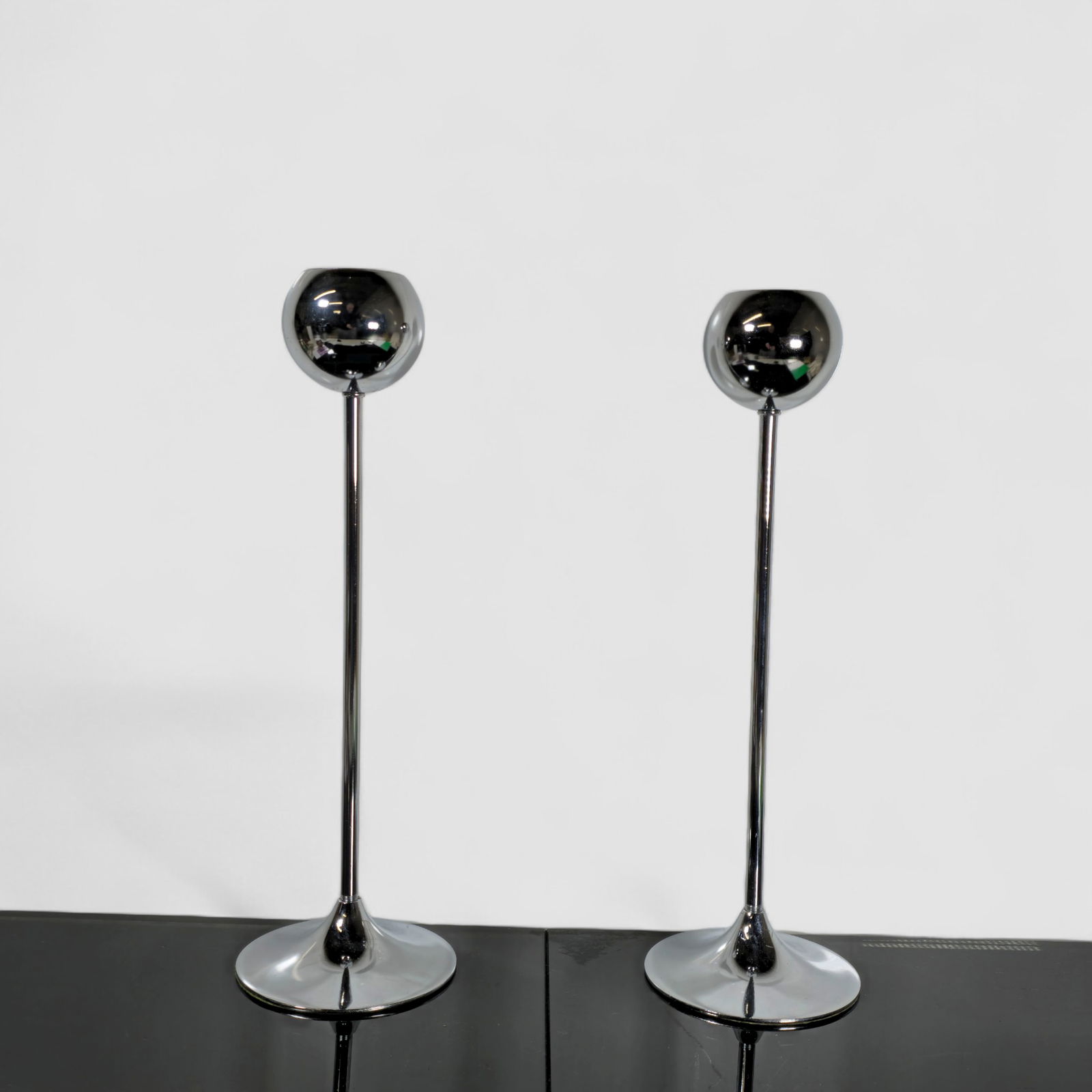 MCM Italian Candleholders: MCM Italian Candleholders. Pair. Italy. 1970. Chrome plated steel. 5dia x 15 1/2h.