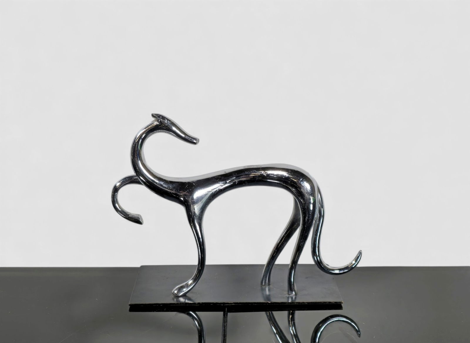 Laszlo Hoenig Greyhound Sculpture: Laszlo Hoenig Greyhound Sculpture. Austria. 1930. Unmarked. Chrome plated steel and enameled steel.