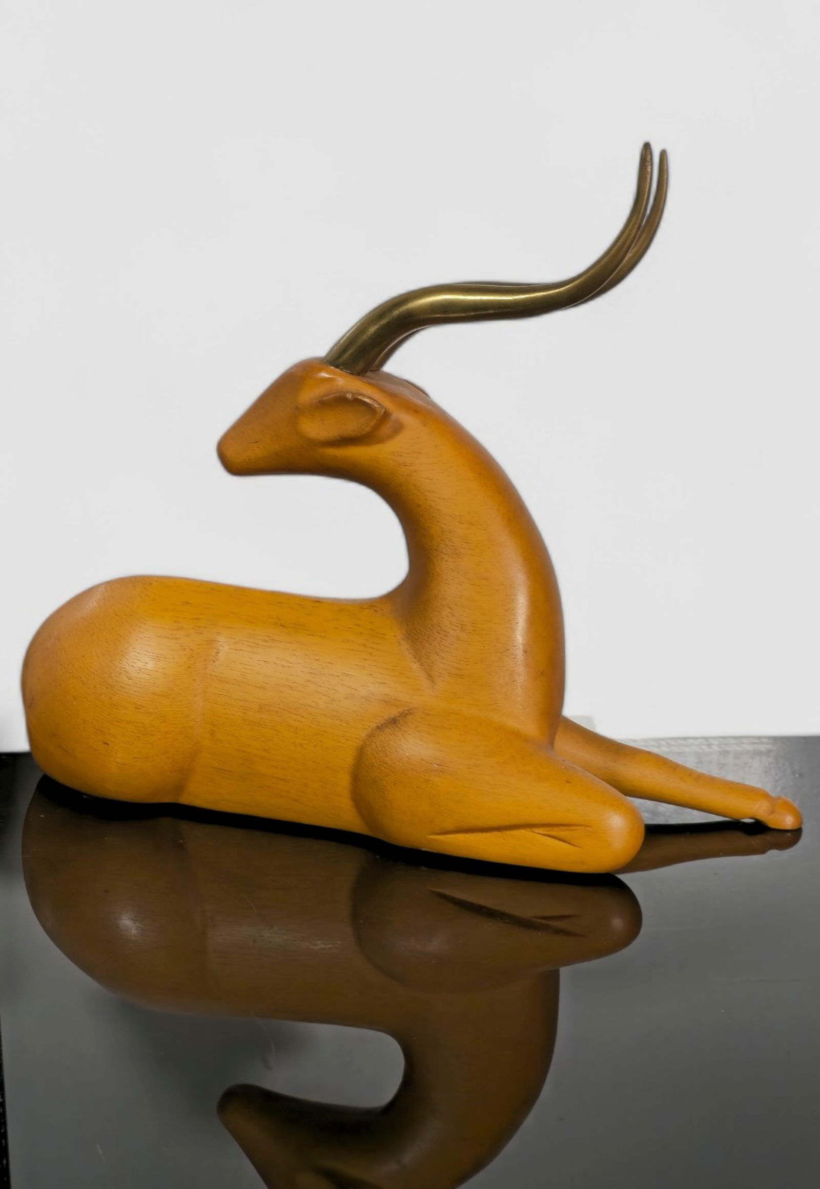 Sarreid Art Deco Revival Recumbent Gazelle: Sarreid Art Deco Revival Recumbent Gazelle. Spain. 1970. Stained Ash and Brass. 10w x 4d x 9 1/2h.