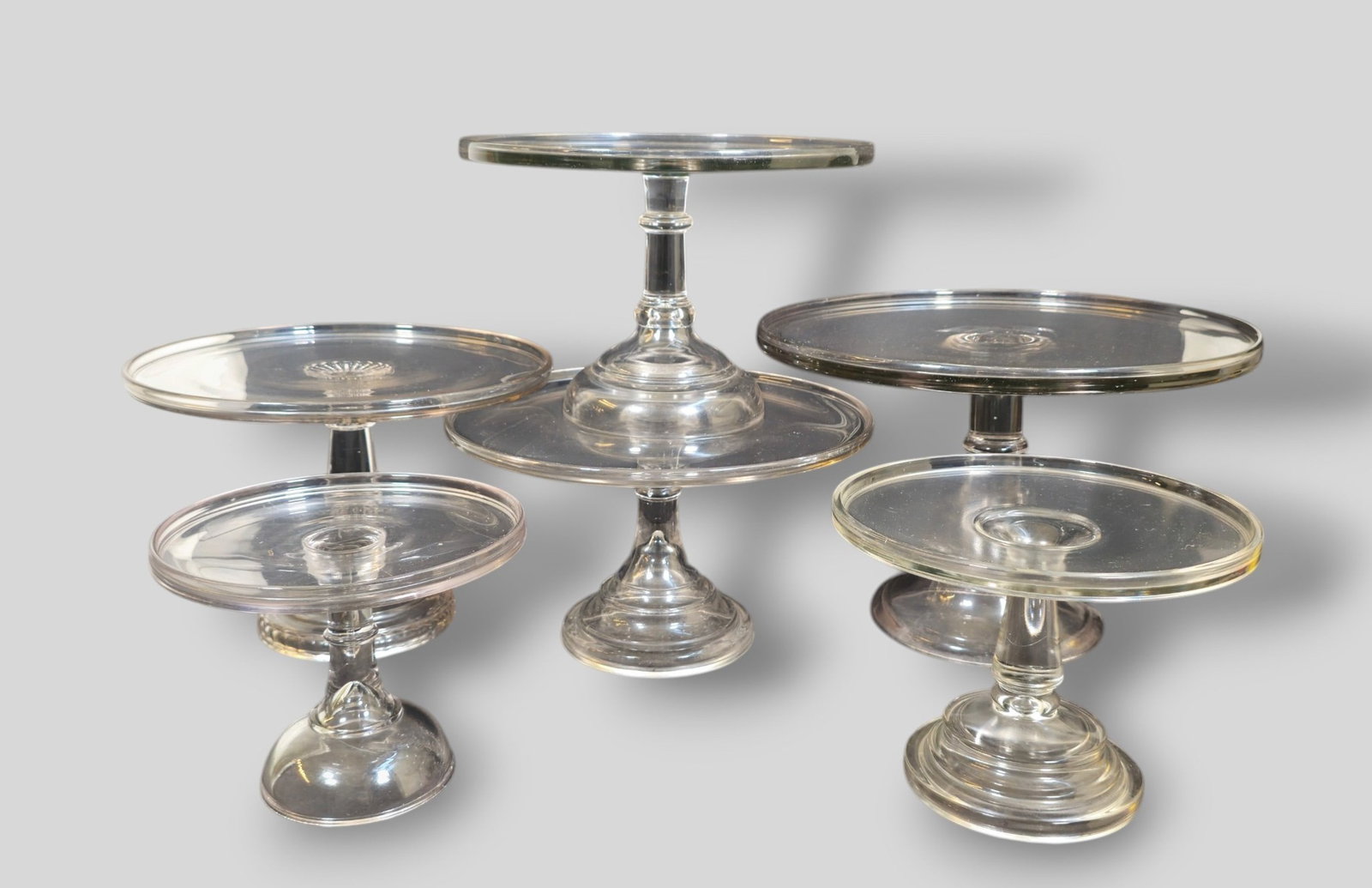 Assembled Grouping Of Pedestal Cake Stands: Assembled Grouping Of Pedestal Cake Stands. 6 total. One pair. 20th Century. Large cake stand 14 1/4dia x 9 3/4h. Smallest 8 1/8 x 6 5/8h.