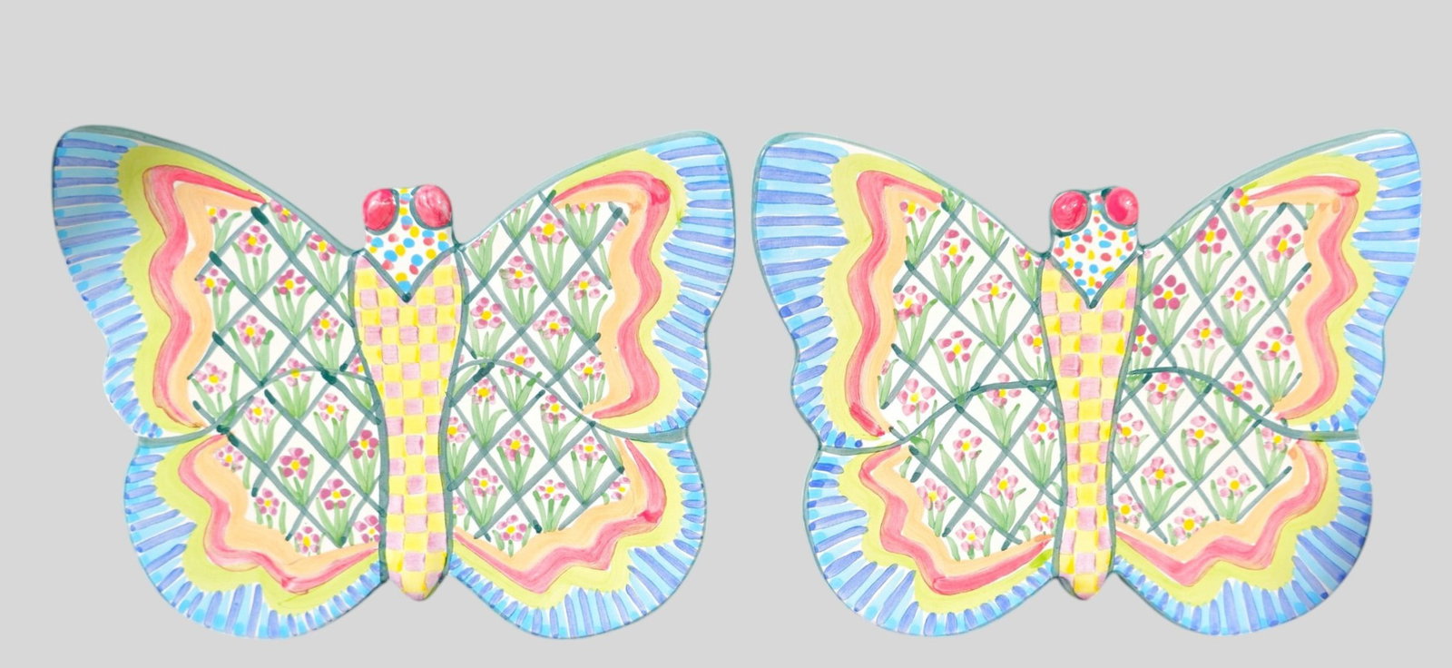 Retired Mackenzie-Childs "Summer Frock" Butterfly Trivets, 2008: Retired Mackenzie-Childs "Summer Frock" Butterfly Trivets, 2008. Manufacturer's marks to underside. Glazed terracotta. 10 1/2w x 8 1/2d x 7/8h.