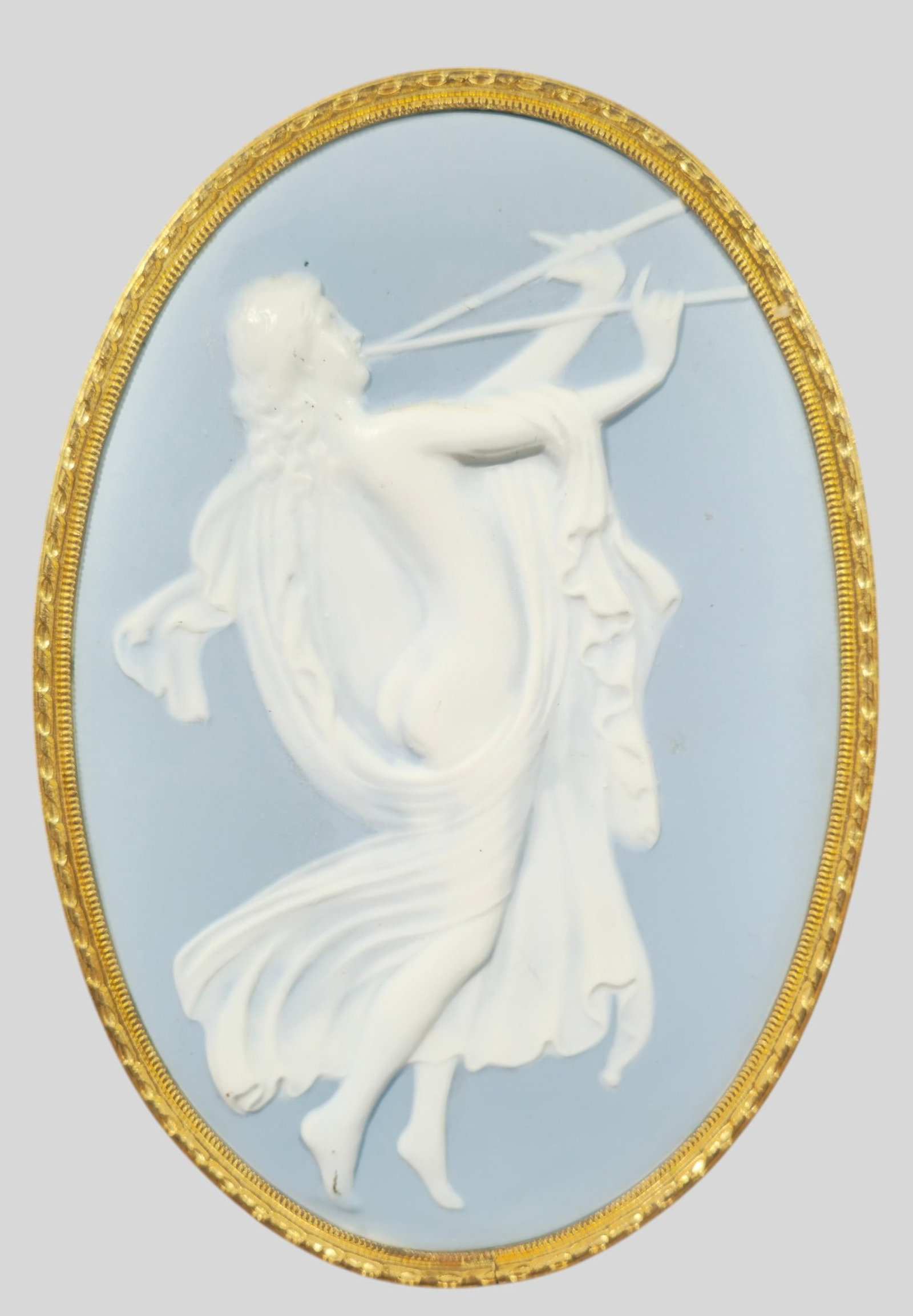Limoges Pate Sur Pate Porcelain Plaque: Limoges Pate Sur Pate Porcelain Plaque. Translucent Figure of a maiden blowing horns on a blue ground. Signed Limoges to verso. Housed in gilt metal frame. 7w x 10 1/4h.