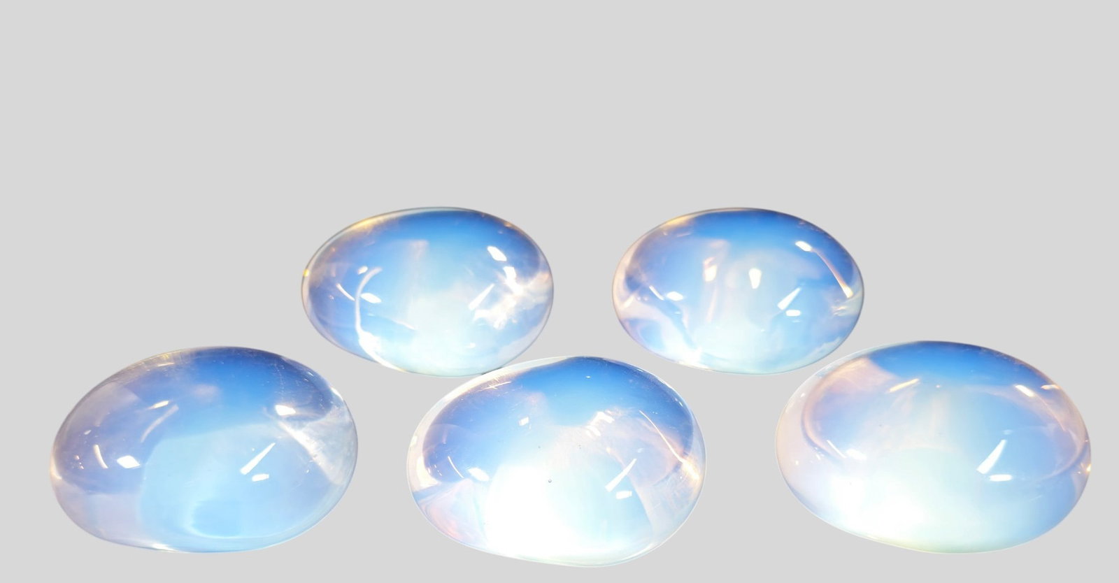 MCM Opalescent Glass Paperweights: MCM Opalescent Glass Paperweights. 5 total. 1970. Egg form. 2 1/2w x 2d x 1 5/8h.