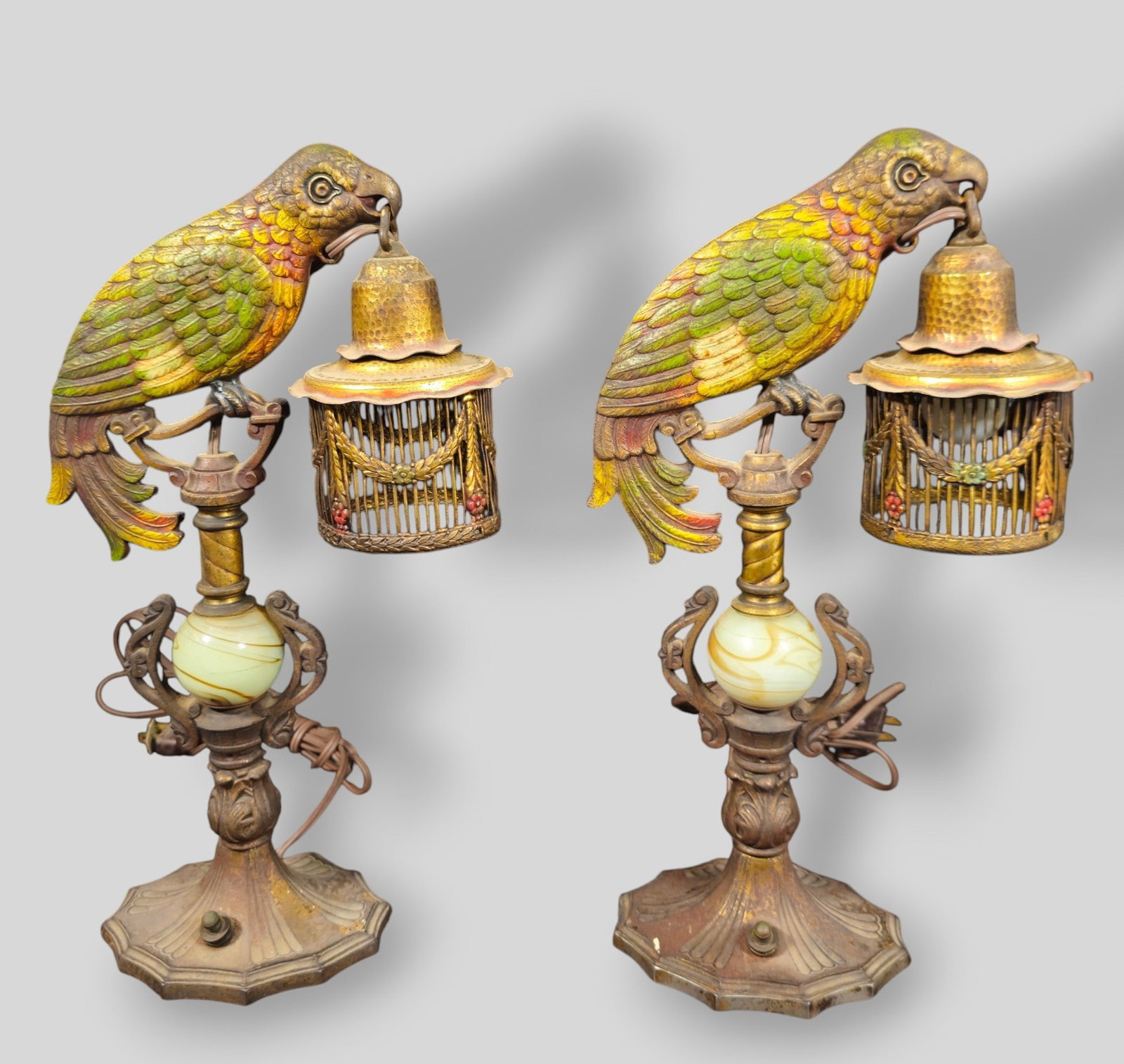 Bradley & Hubbard Polychrome Cast Iron And Uranium Gass Parrot Lamps: Bradley & Hubbard Polychrome Cast Iron And Uranium Gass Parrot Lamps. Pair. USA, 1920s. 8 1/4w x 4 1/4d x 15h