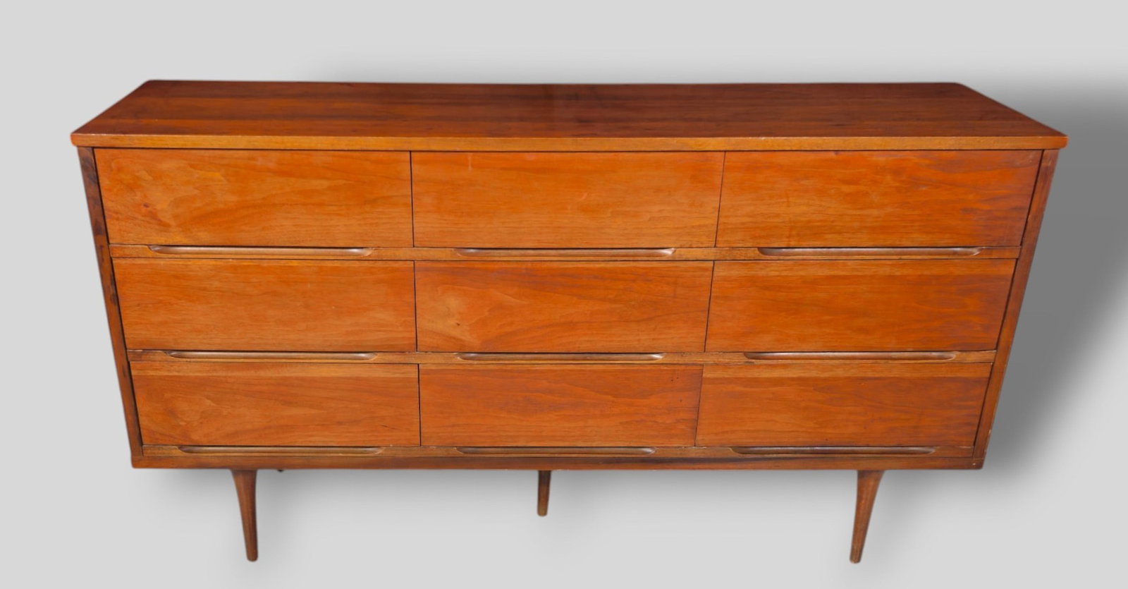 MCM Walnut Dresser: Mid Century Modern dresser. USA, 1960s. 9 drawers. Walnut. 58 1/2w x 18d x 31 1/4h.