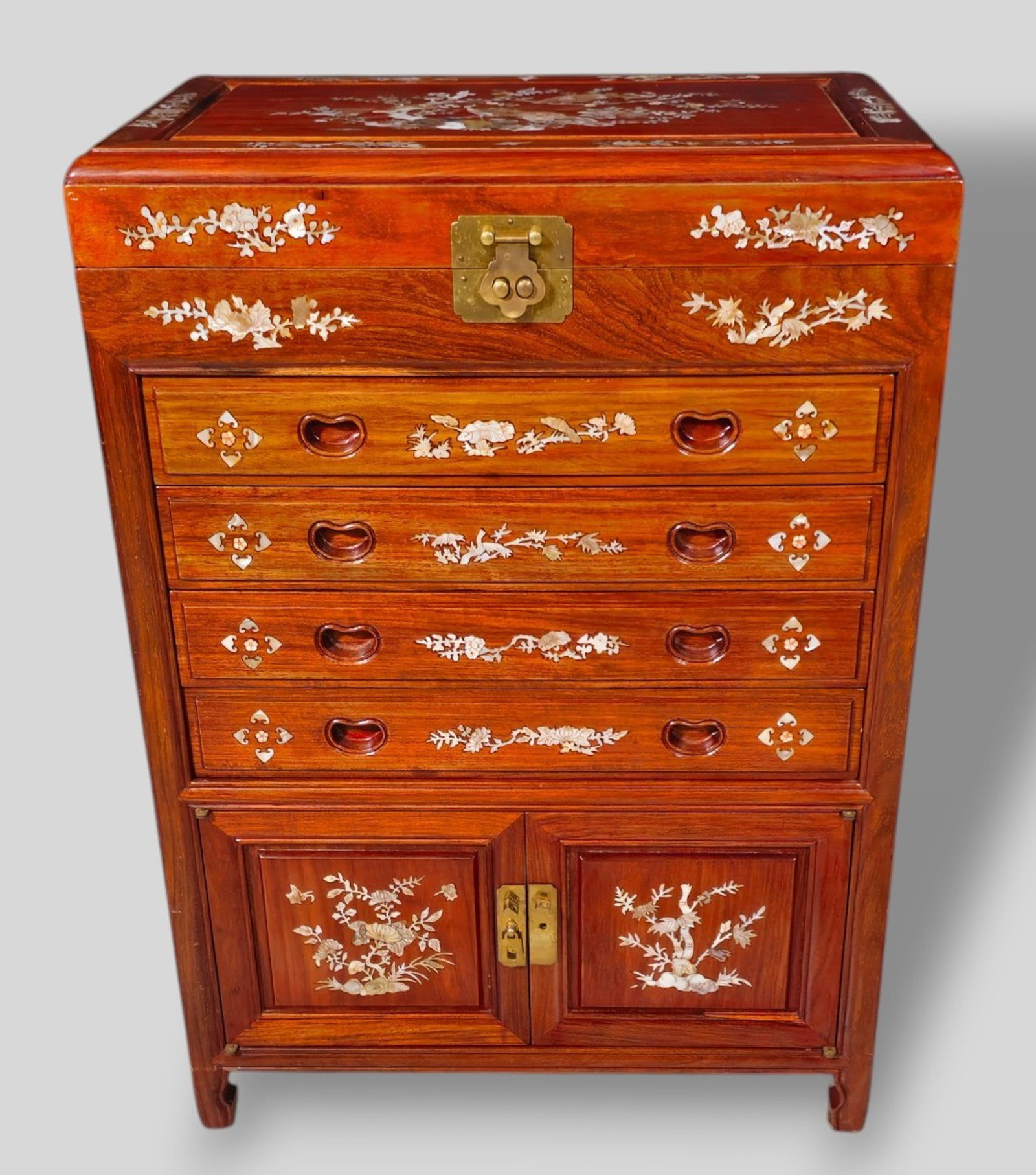 Chinese Teak & MOP Inlay Jewelry/Silver Chest: Chinese Teak & MOP Inlay Jewelry/Silver Chest. 20th century. Hinged top with birds of paradise tree, mother of pearl inlay. Floral and bird motif border. 4 drawers over two doors. Mother of pearl