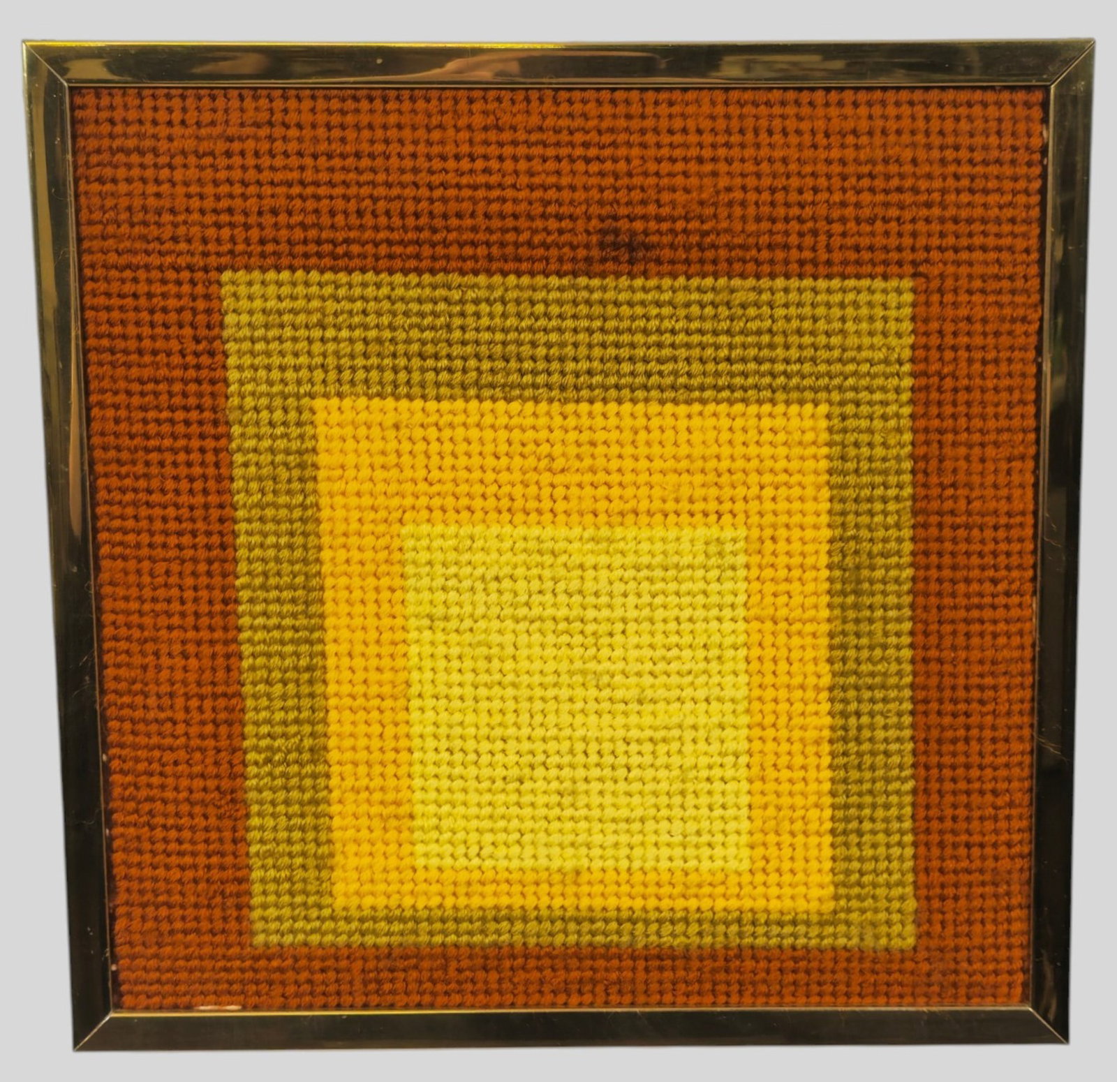 After Josef Albers Needlepoint: Homage to The Square Needlepoint. Early 1970s. Sight 11 3/4 x 11 3/4. Frame 13 x 13.