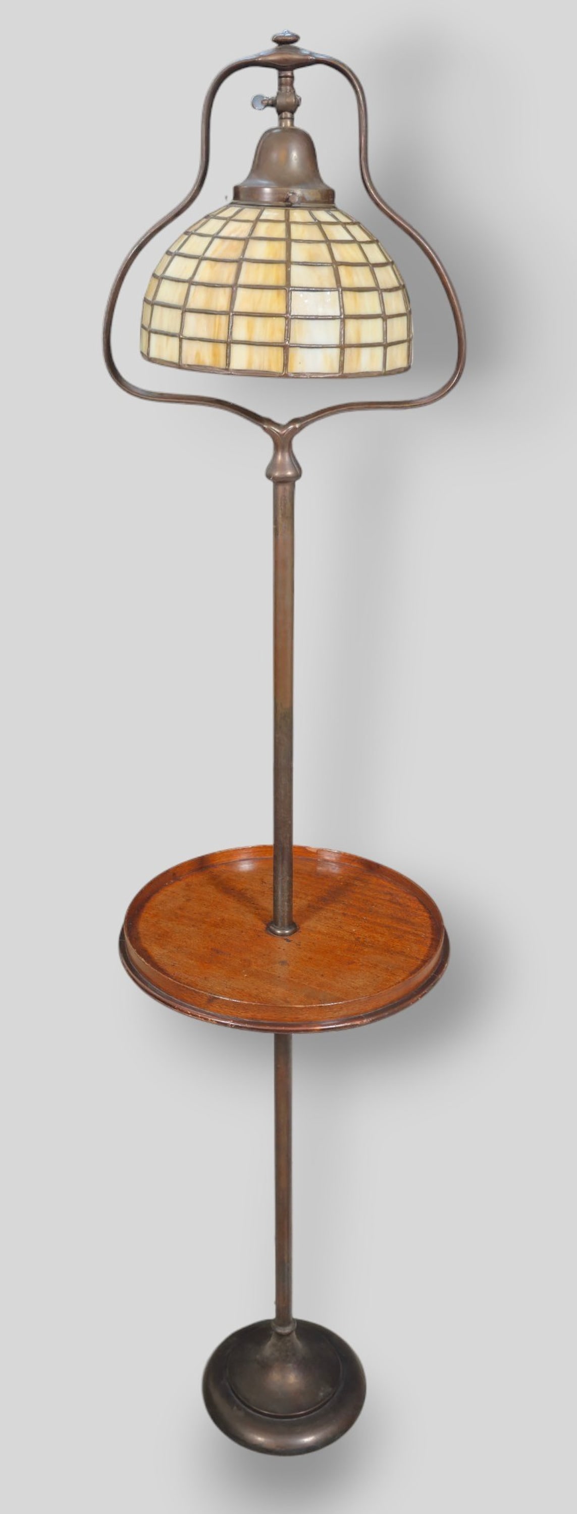 Handel Attribution Bronze and Leaded Glass Bell Floor Lamp: Handel Attribution Bronze and Leaded Glass Bell Floor Lamp. Early 20th Century. Unusual mahogany shelf. 3h Beautiful leaded glass shade. Shade diameter 10 inches. Overall 15dia x 63h.