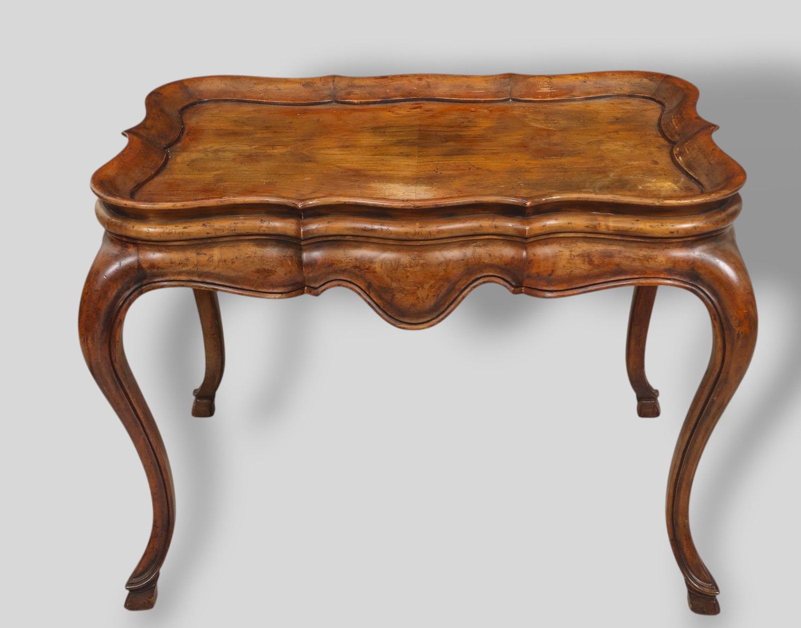 Baker Furniture French Provincial Collection Louie XV Cocktail Table: Baker Furniture French Provincial Collection Louie XV Cocktail Table. 20th Century. Walnut. Table #3978 and Manufacturer's silver label to underside. 73 1/2w x 26d x 34 3/4h. Sh 13(Without cushion)