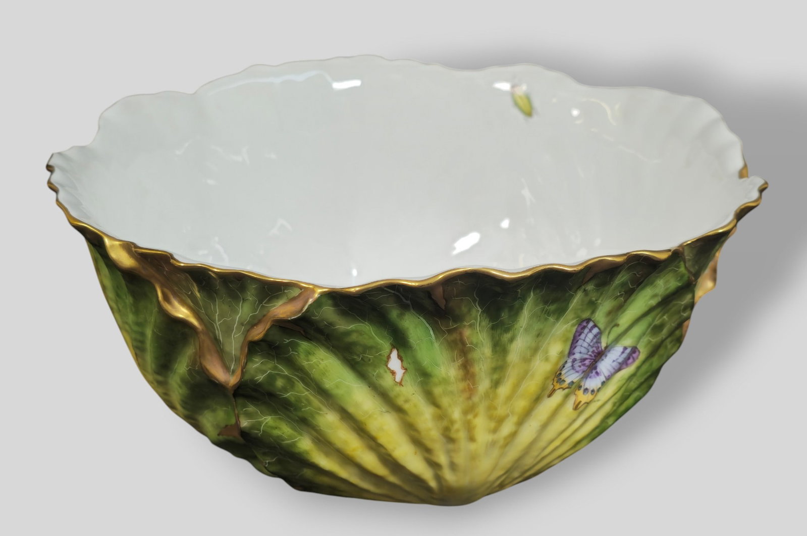 Anna Weatherley Porcelain Cabbage Butterfly Bowl: Anna Weatherley Porcelain Cabbage Butterfly Bowl. Hungary. Hand Painted with different insects over cabbage design. Scalloped border with gilt borders. Manufacturer's marks to underside. 9 7/8w x 10
