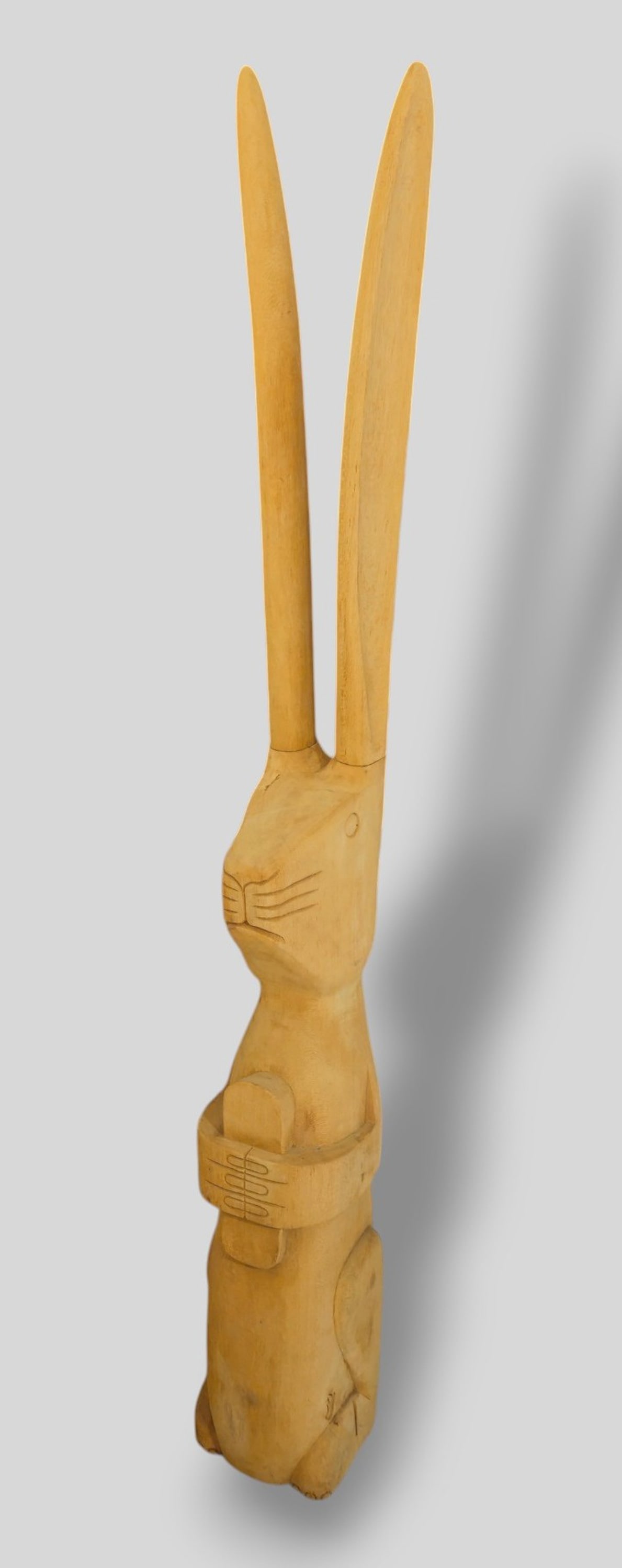 Folk Art Hand Carved Rabbit Sculpture: Folk art Hand Carved Rabbit Sculpture. 20th Century. Upright rabbit with detachable ears. 7w x 8 1/2 x 56 1/2h.